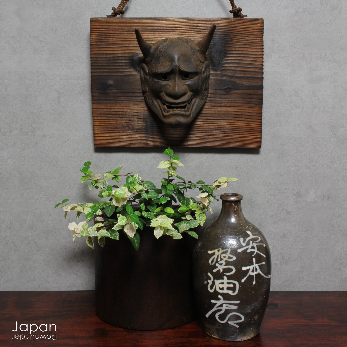 Enhance your space with this unique piece of Japanese folk art! A captivating old rusted bronze Hannya mask mounted on a charming rustic wood plaque - a truly wonderful addition to your wall decor. Infuse your home with the character and culture of this stunning find!