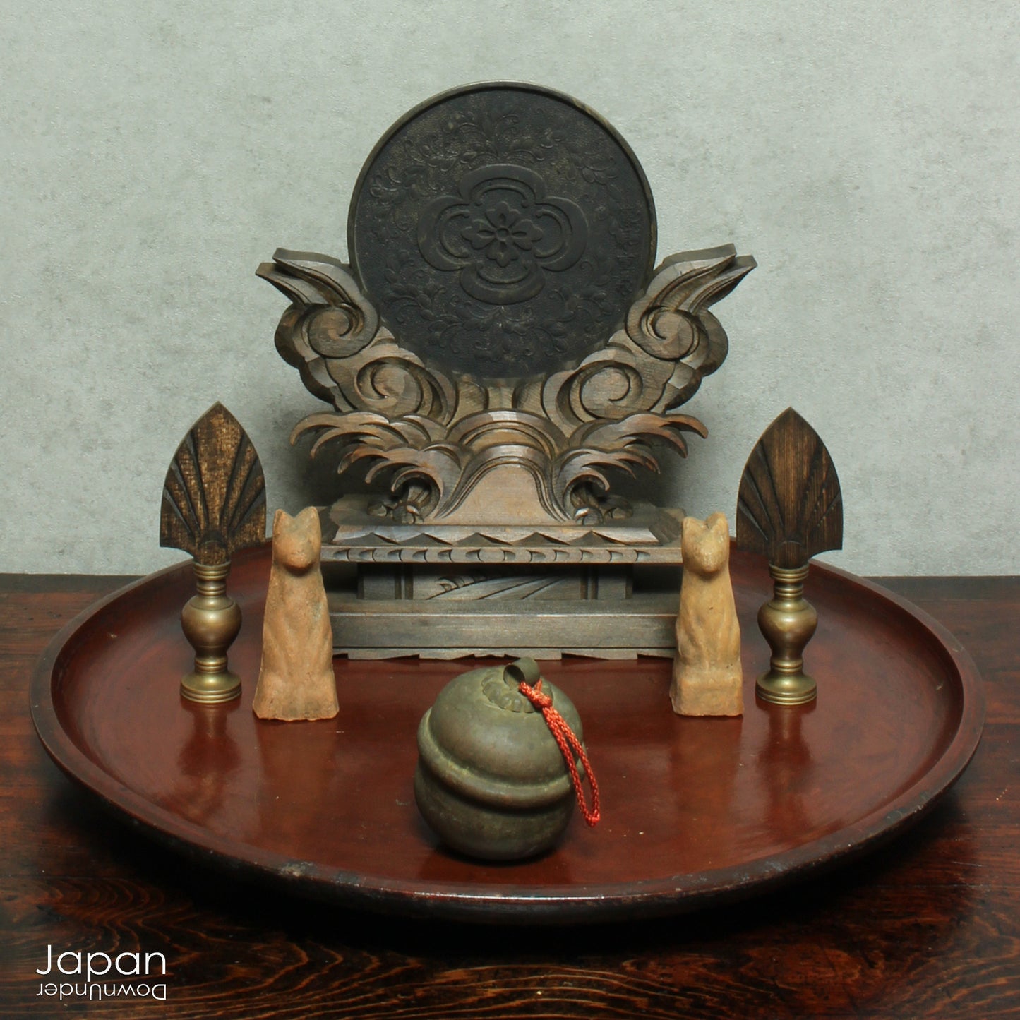 A stunning 1800’s Japanese folk art round serving tray. This versatile piece doubles as a unique display stand adding a touch of rustic charm to any decor. The beautiful dark wine red and black color palette showcases the wonderful patina of use, making it a truly one-of-a-kind art object.