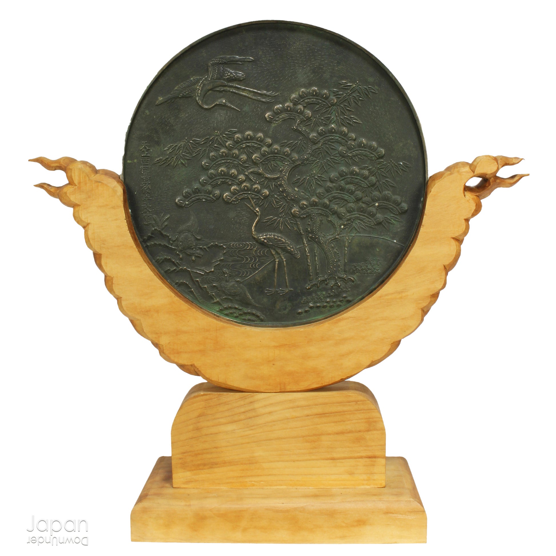 Enhance your spiritual space with this majestic rare antique Shinto shrine mirror. Resting on an intricately carved stand, this piece is a unique and beautiful addition to any sacred setting. Invite tranquility and elegance into your home with this spiritual space enhancer.