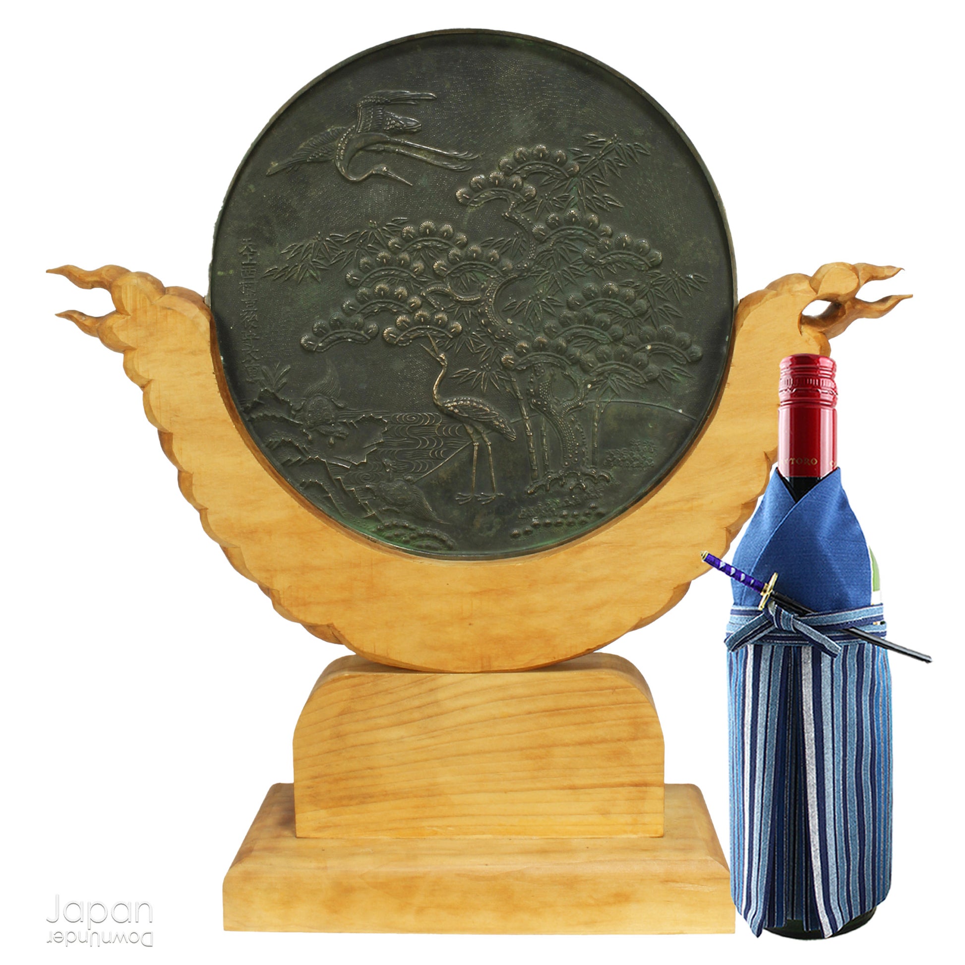 Enhance your spiritual space with this majestic rare antique Shinto shrine mirror. Resting on an intricately carved stand, this piece is a unique and beautiful addition to any sacred setting. Invite tranquility and elegance into your home with this spiritual space enhancer.