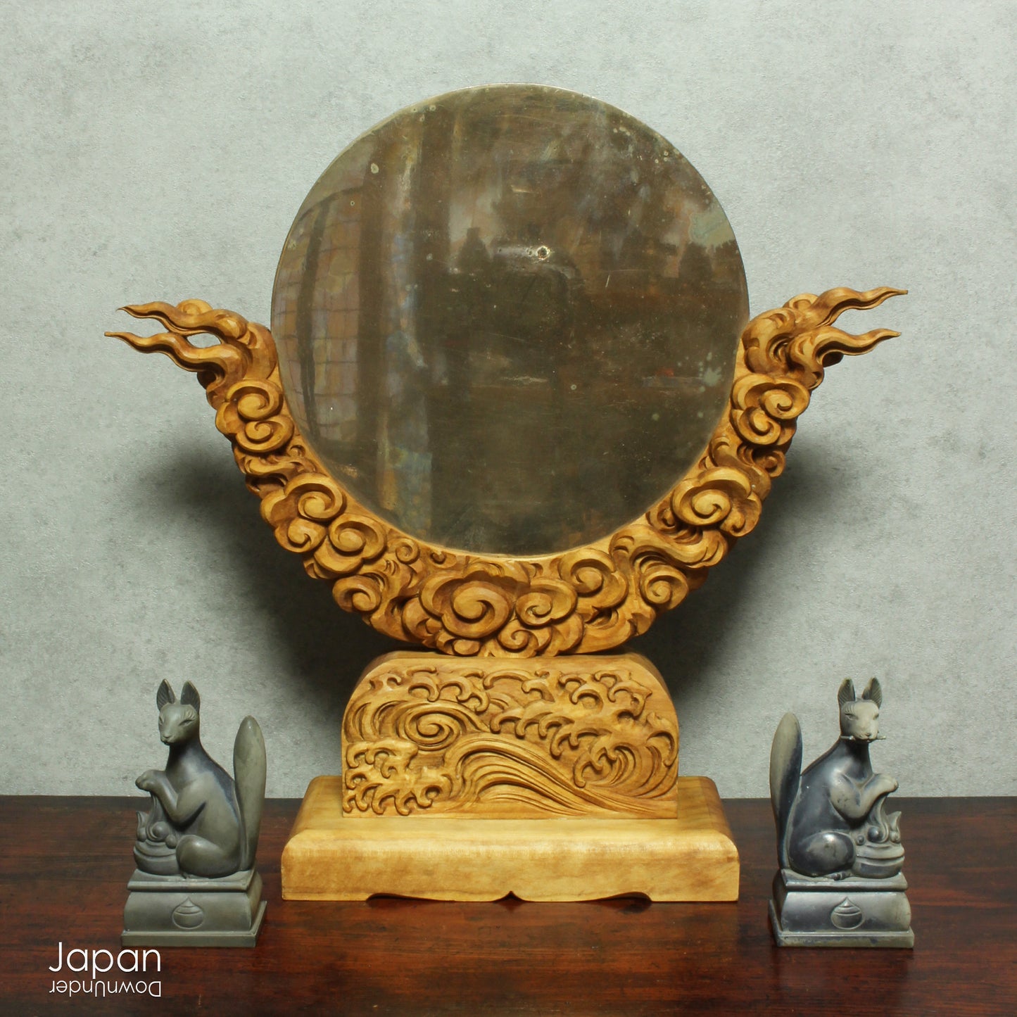 Enhance your spiritual space with this majestic rare antique Shinto shrine mirror. Resting on an intricately carved stand, this piece is a unique and beautiful addition to any sacred setting. Invite tranquility and elegance into your home with this spiritual space enhancer.