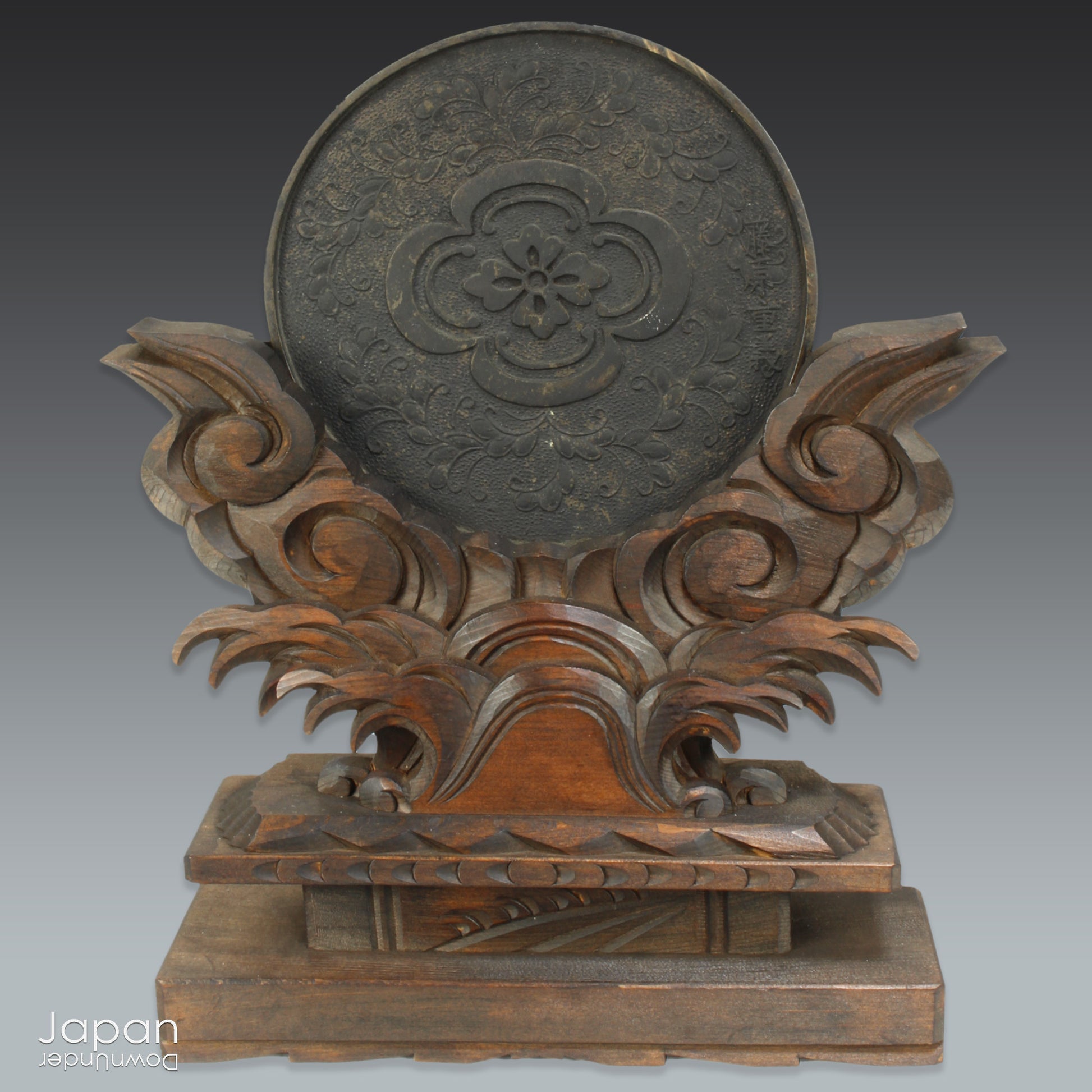 Infuse your home with serenity and spiritual elegance with this wonderful Shinto shrine mirror. Set upon an intricately carved wooden stand, this stunning piece is more than just a decor item—it’s a meaningful addition to any space that seeks harmony and balance.