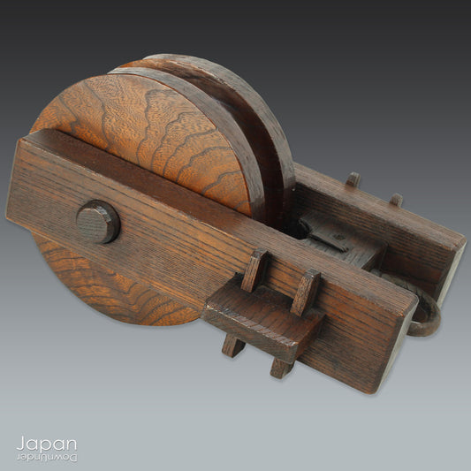 Bring a touch of authentic Japanese rustic charm into your home or garden with this exquisite antique well pulley, a fine example of traditional mingei (folk craft). Expertly crafted from keyaki (Japanese zelkova), a highly prized hardwood known for its strength and stunning grain, this piece is both a functional relic and a beautiful decorative accent.
