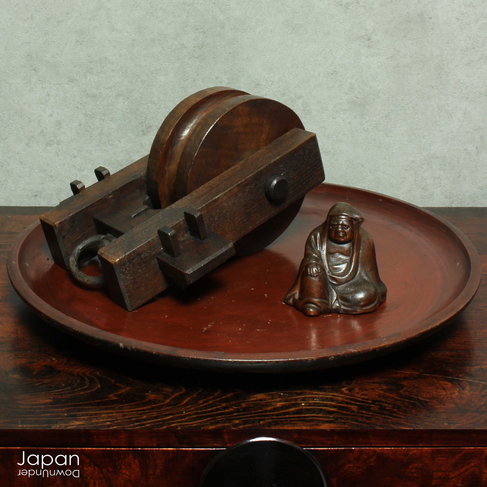 Bring a touch of authentic Japanese rustic charm into your home or garden with this exquisite antique well pulley, a fine example of traditional mingei (folk craft). Expertly crafted from keyaki (Japanese zelkova), a highly prized hardwood known for its strength and stunning grain, this piece is both a functional relic and a beautiful decorative accent.