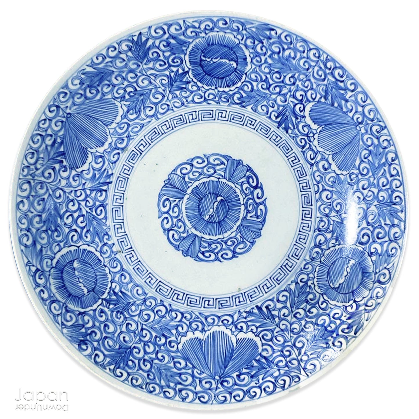 Transport yourself to the elegance of the Meiji era with this exquisite antique blue and white serving plate. Featuring an intricate karakusa (lucky vine) design, this stunning Imari plate will undoubtedly captivate any admirer of Japanese porcelain artistry. A perfect addition for collectors, it not only adds a touch of history and sophistication to your space, but also serves as a stylish way to present your favorite dishes.