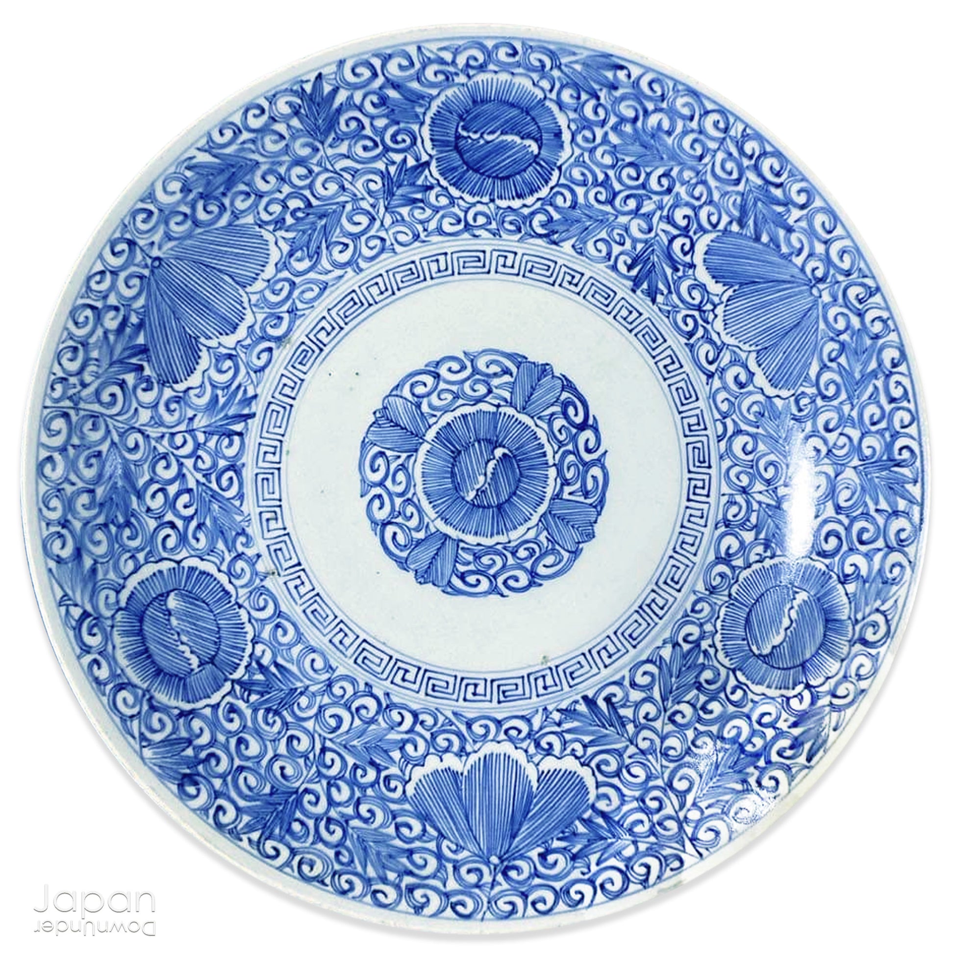 Transport yourself to the elegance of the Meiji era with this exquisite antique blue and white serving plate. Featuring an intricate karakusa (lucky vine) design, this stunning Imari plate will undoubtedly captivate any admirer of Japanese porcelain artistry. A perfect addition for collectors, it not only adds a touch of history and sophistication to your space, but also serves as a stylish way to present your favorite dishes.