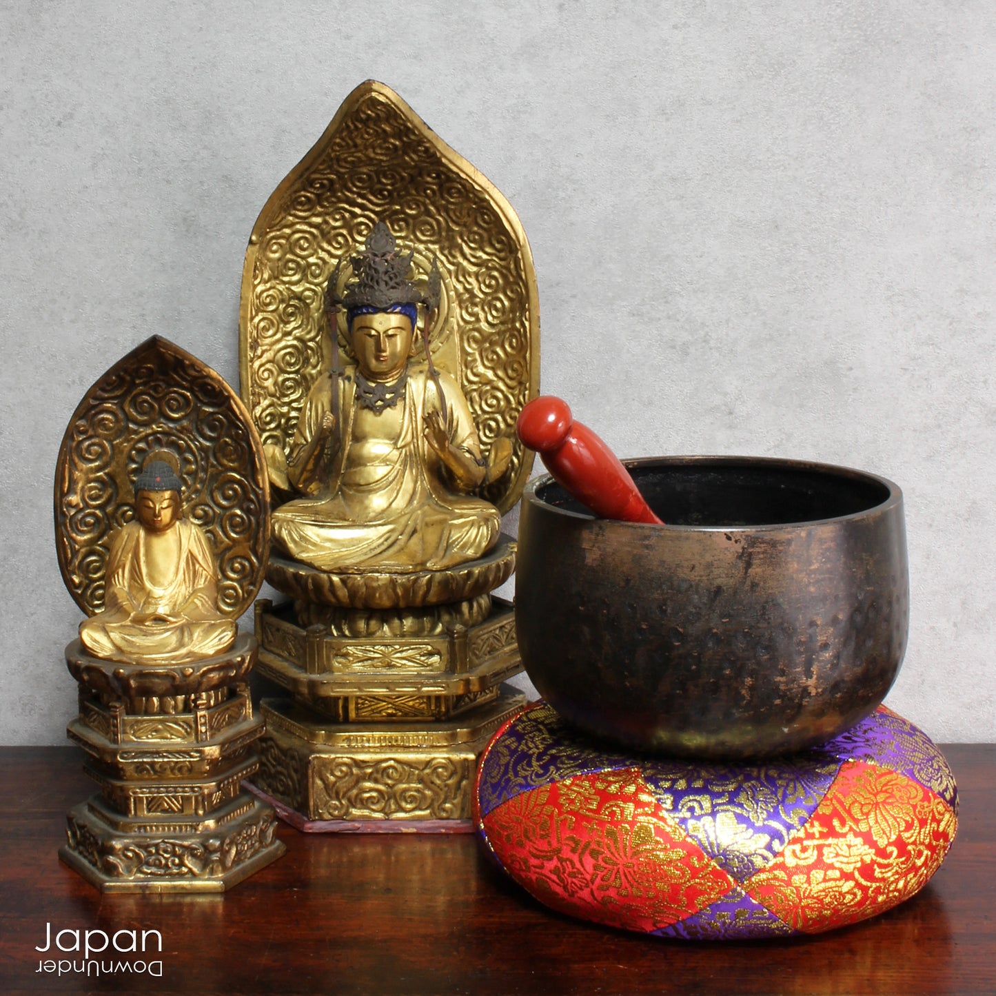 A Japanese orin from a Buddhist temple. The set includes a zabuton cushion, a singing bowl and a rinbo or striker. Orin like this are placed on the offering table, for prayer and worship, in the main hall, where the object of worship is enshrined.