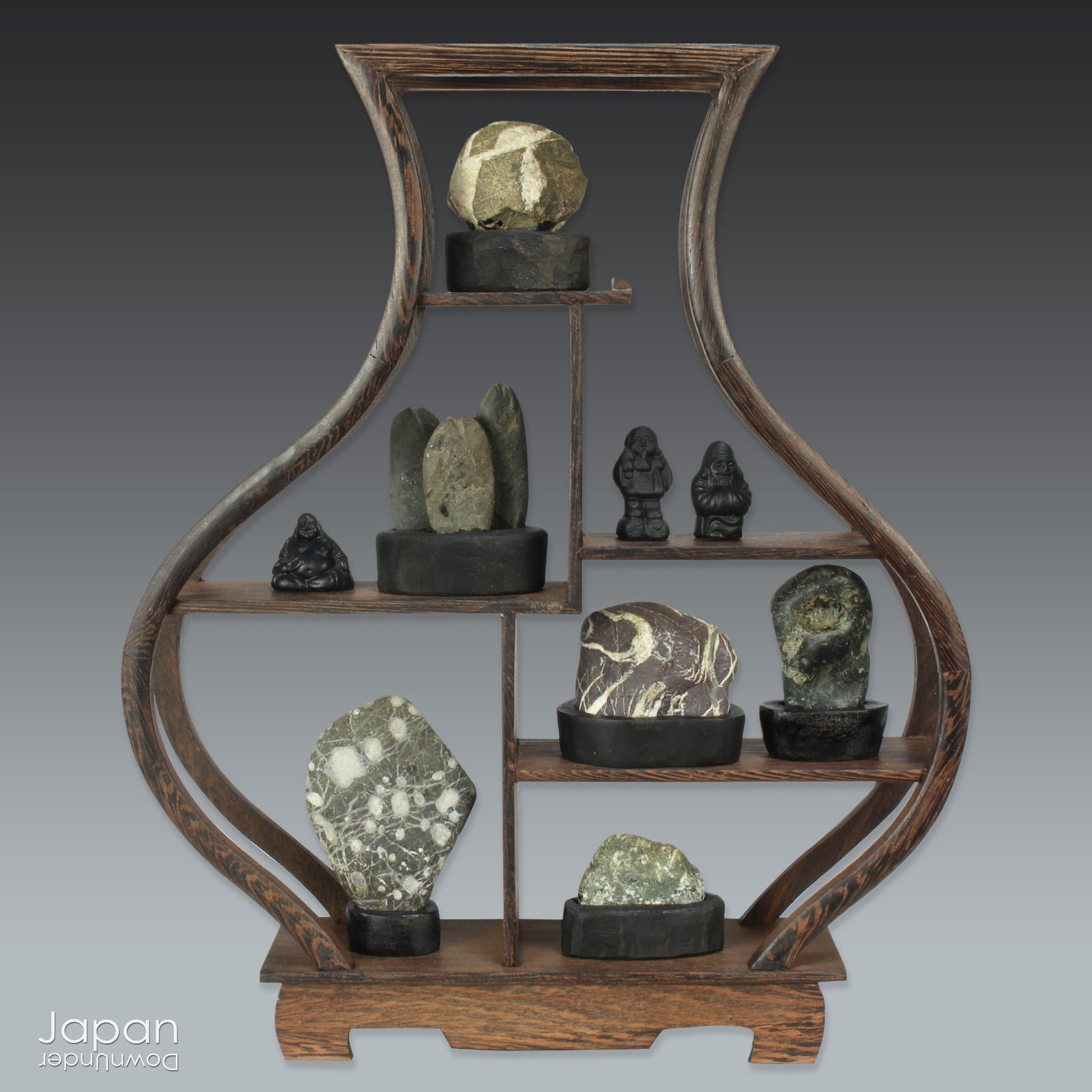 Elevate your home decor with this striking, modern collection of vintage Japanese miniature suiseki stones, beautifully arranged on a handcrafted, vase-shaped segmented shelf. These naturally sculpted stones evoke the essence of serene landscapes and bring a sense of harmony, sophistication, and contemplative stillness to any space.