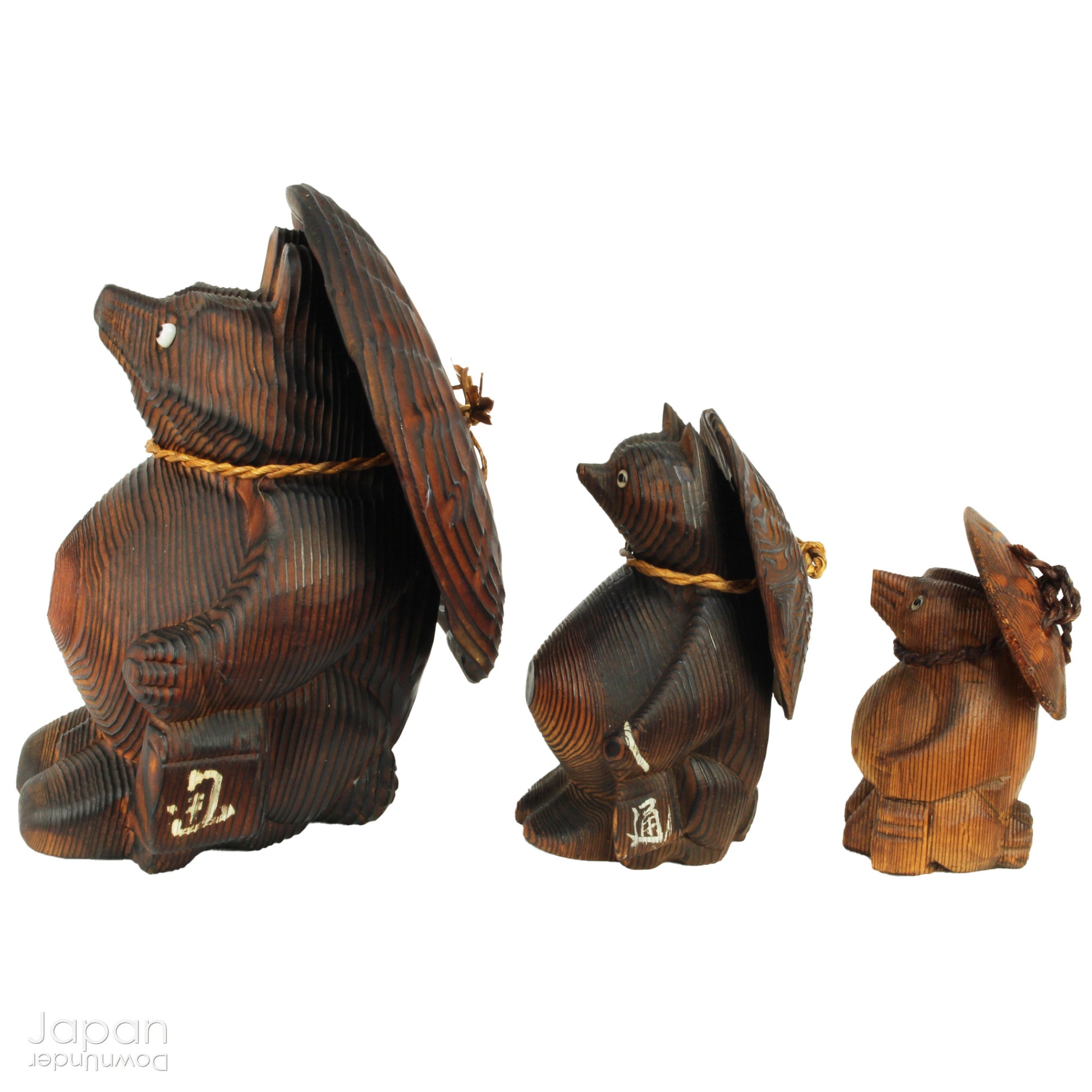 Add a dash of charm and cultural richness to your home with this delightful set of three antique Japanese tanuki wood carvings - authentic examples of traditional Japanese folk art, long believed to be bringers of good luck and prosperity.