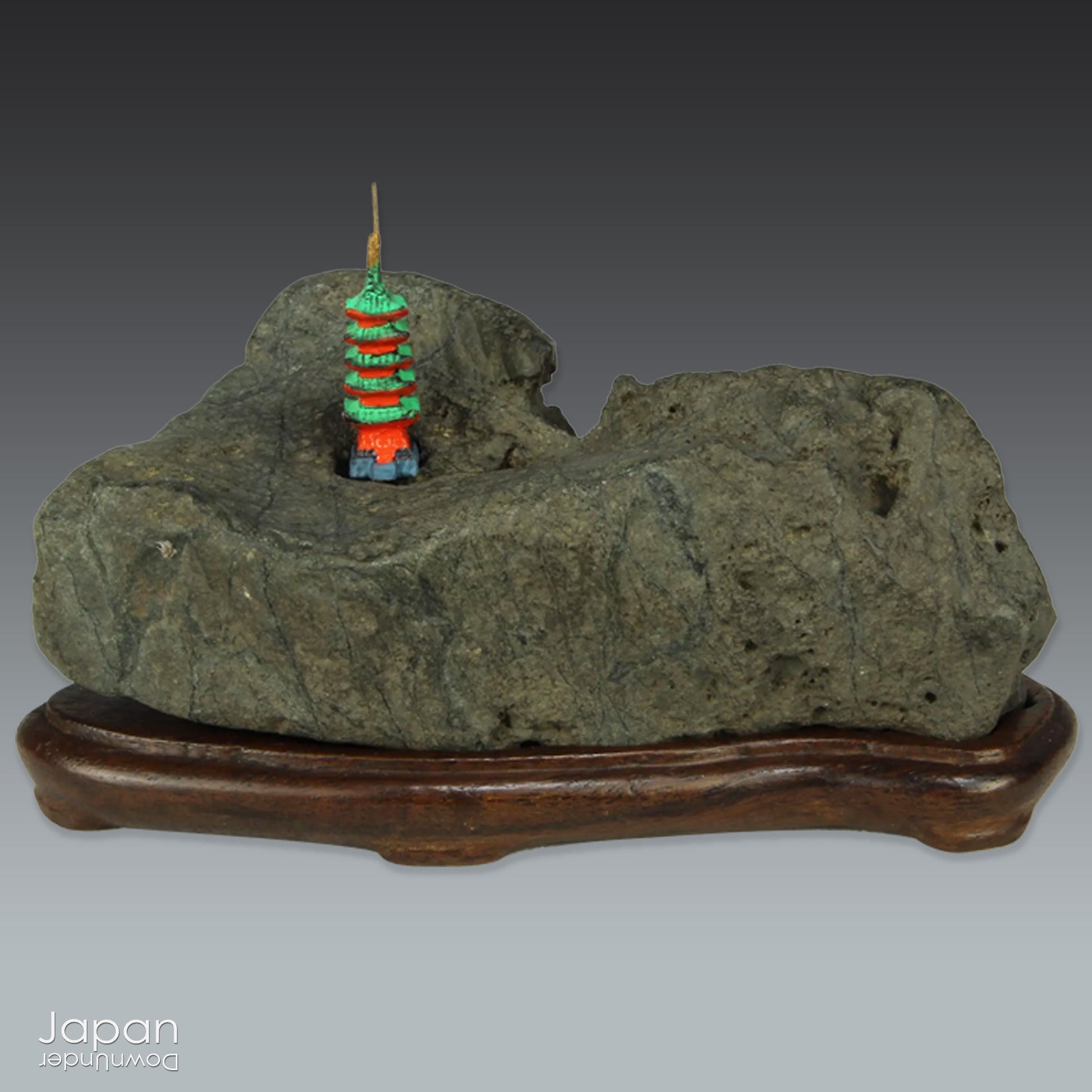 This vintage Japanese suiseki offers a quiet meditation on nature’s artistry ;a naturally weathered stone that embodies stillness, grace, and introspection. Resting atop an intricately hand-carved daiza, it invites the viewer into a space of reflection and reverence, where simplicity holds profound depth.