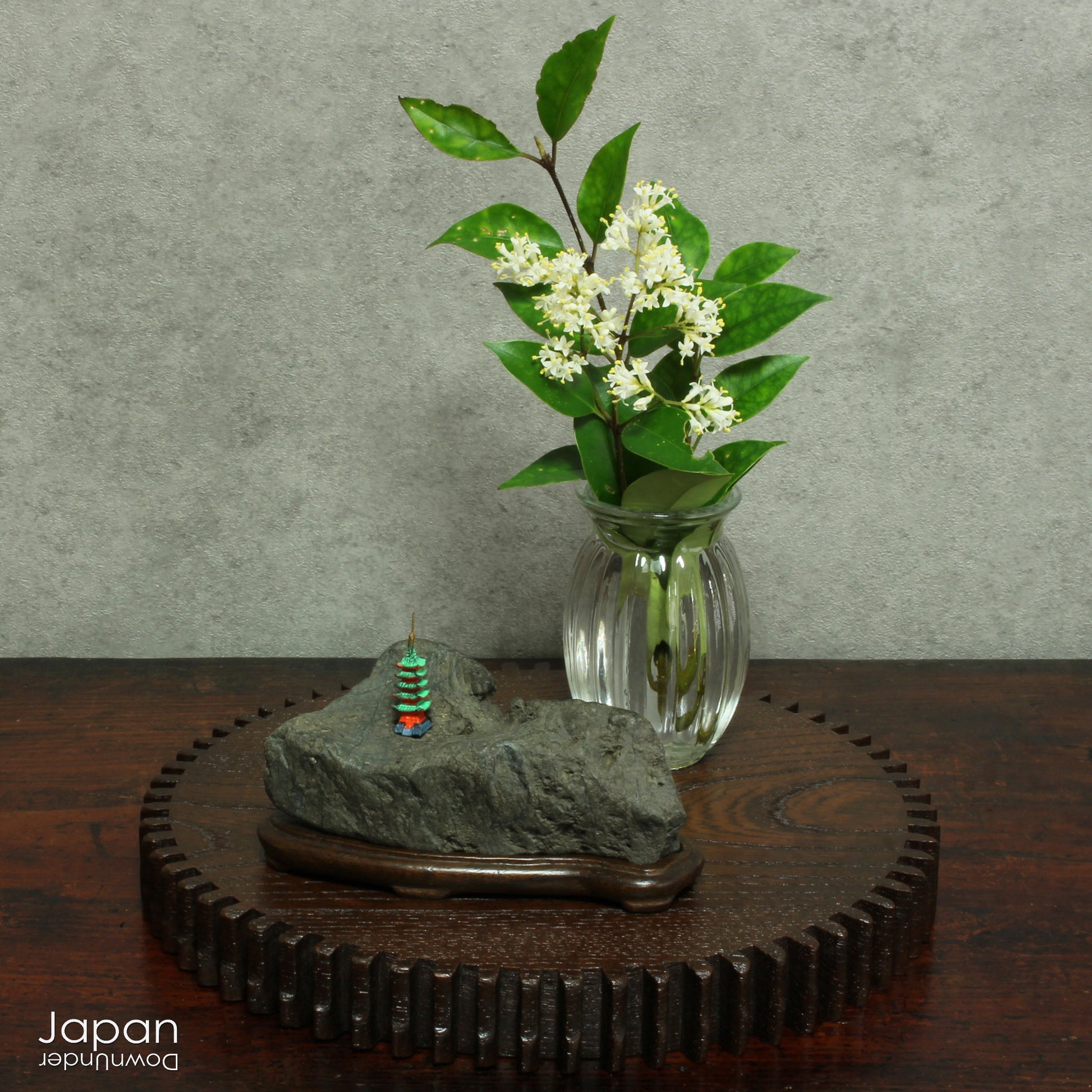 This vintage Japanese suiseki offers a quiet meditation on nature’s artistry ;a naturally weathered stone that embodies stillness, grace, and introspection. Resting atop an intricately hand-carved daiza, it invites the viewer into a space of reflection and reverence, where simplicity holds profound depth.