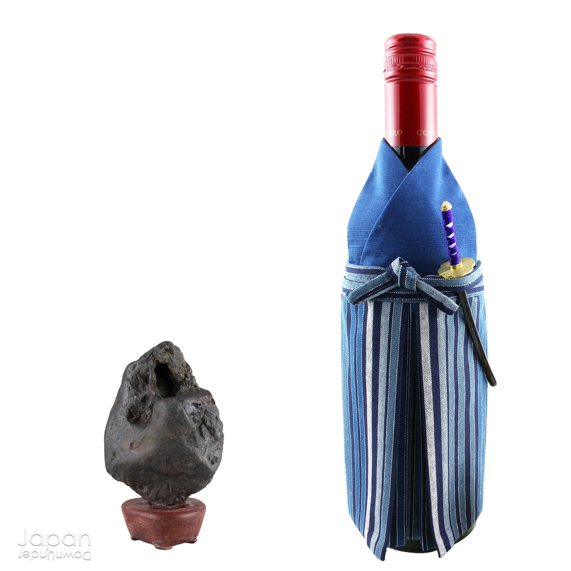 Gracefully poised atop a hand-carved wooden daiza (stand), this suiseki stone emanates a quiet, contemplative energy - making it an ideal centerpiece for spaces devoted to mindfulness, reflection, or artistic inspiration.