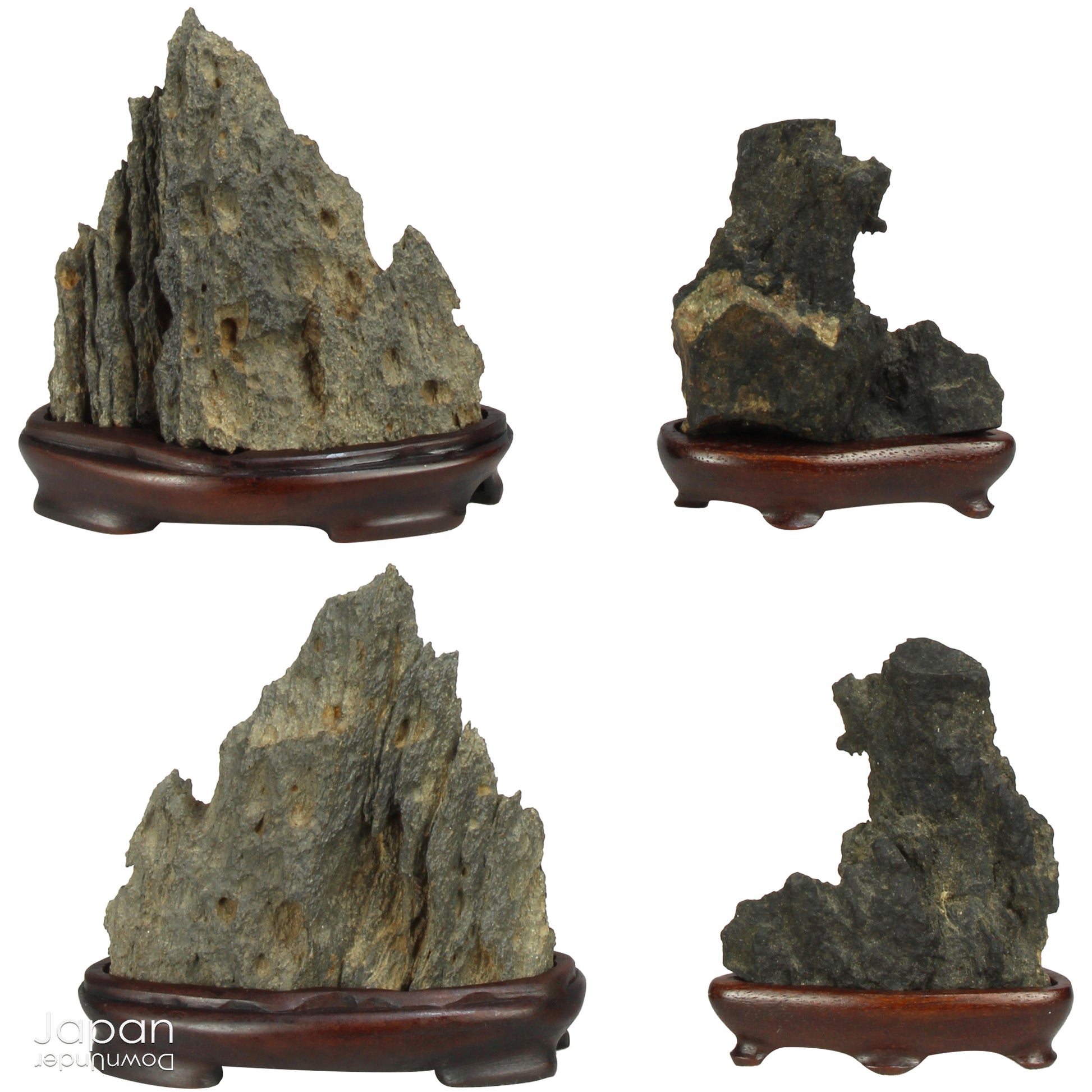 Invite serenity and understated beauty into your space with this remarkable collection of seven vintage miniature Japanese suiseki - natural “water stones” cherished for their quiet symbolism and evocative forms. Each small stone rests atop a finely hand-carved ebony daiza (stand), thoughtfully crafted to support and elevate its unique presence.