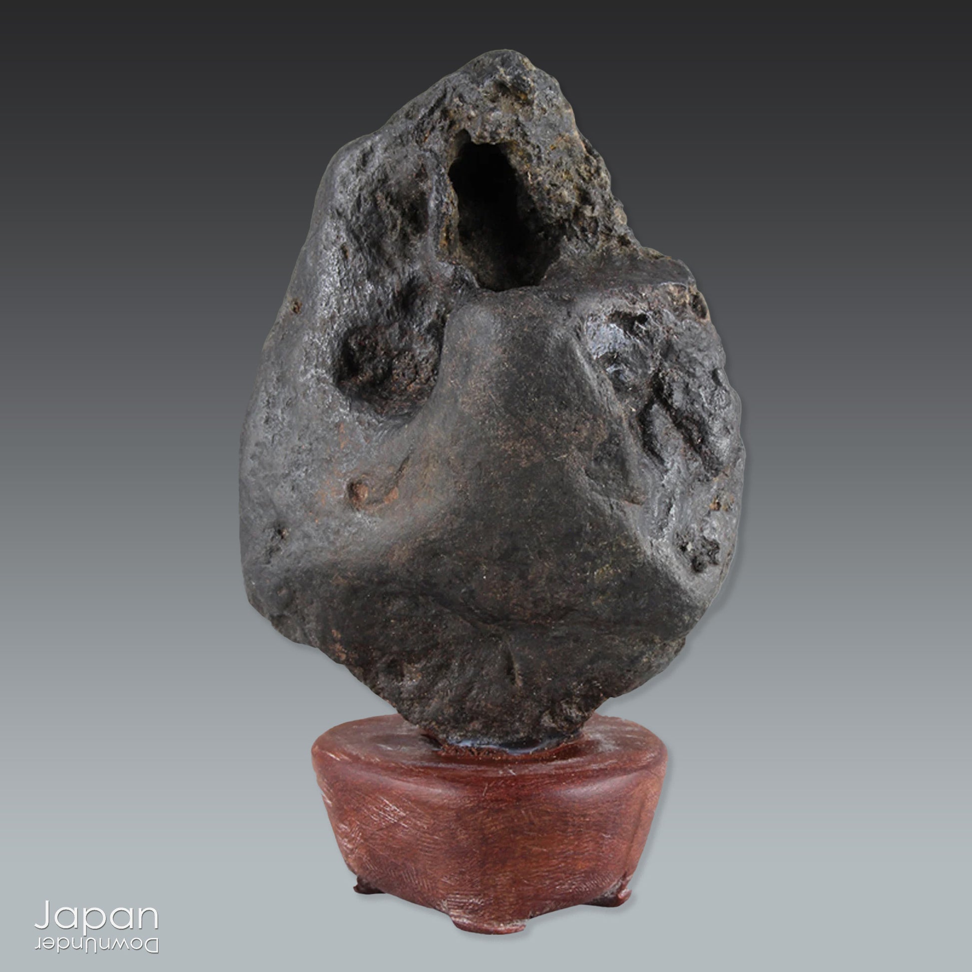 Gracefully poised atop a hand-carved wooden daiza (stand), this suiseki stone emanates a quiet, contemplative energy - making it an ideal centerpiece for spaces devoted to mindfulness, reflection, or artistic inspiration.