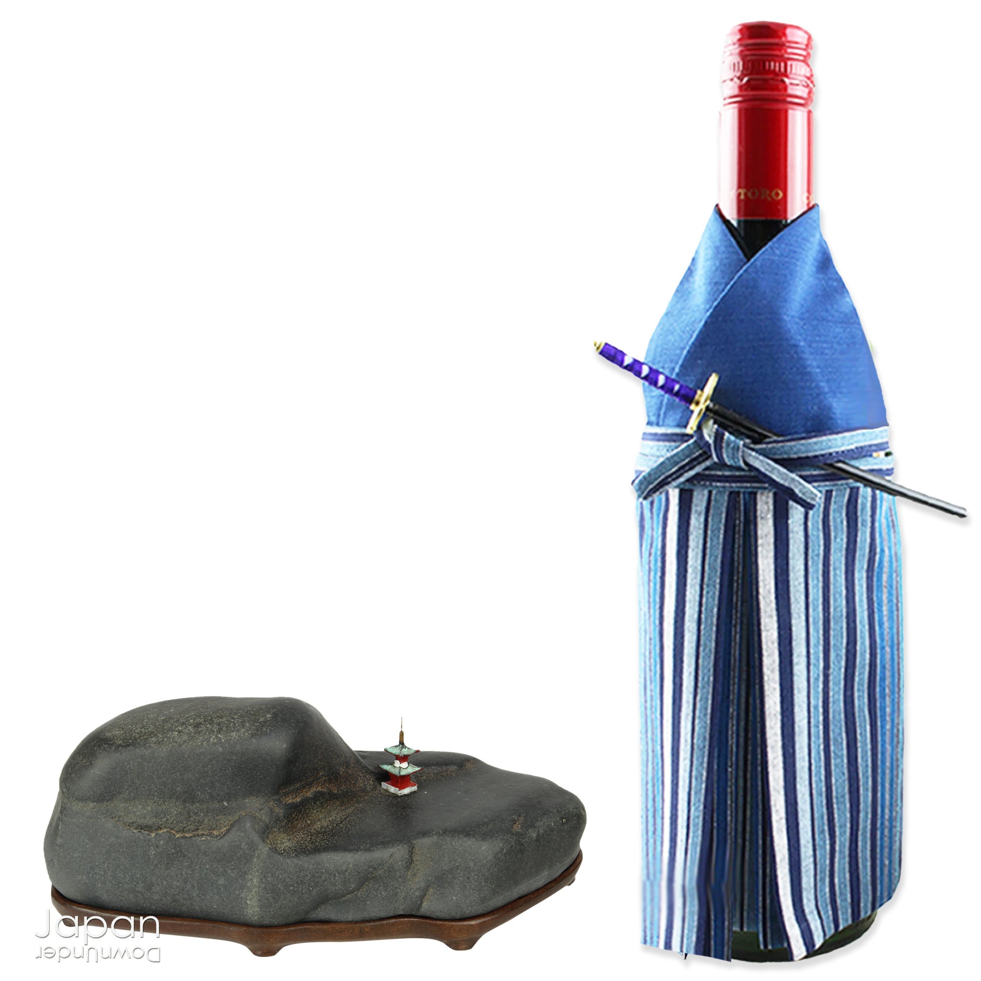 Introduce a quiet elegance and poetic depth to your space with this vintage Japanese suiseki - a contemplative stone shaped by nature and imbued with a serene, spiritual aura. Resting on a finely hand-carved daiza (wooden base) and accompanied by a small metal pagoda, this piece emanates stillness, balance, and an understated visual allure.