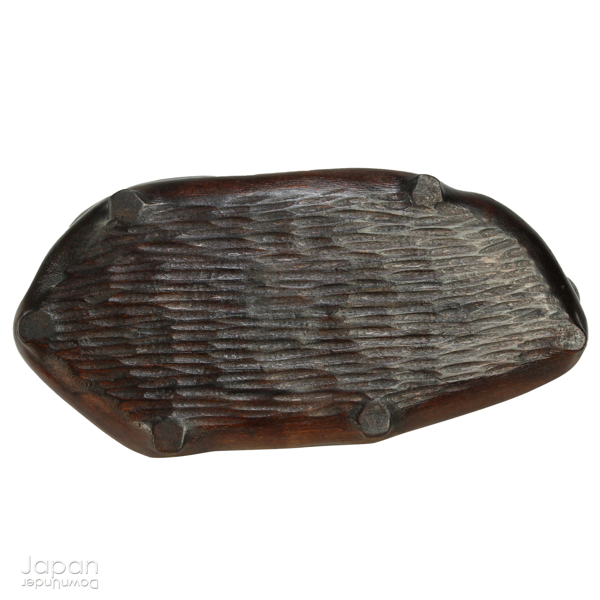 Introduce a quiet elegance and poetic depth to your space with this vintage Japanese suiseki - a contemplative stone shaped by nature and imbued with a serene, spiritual aura. Resting on a finely hand-carved daiza (wooden base) and accompanied by a small metal pagoda, this piece emanates stillness, balance, and an understated visual allure.