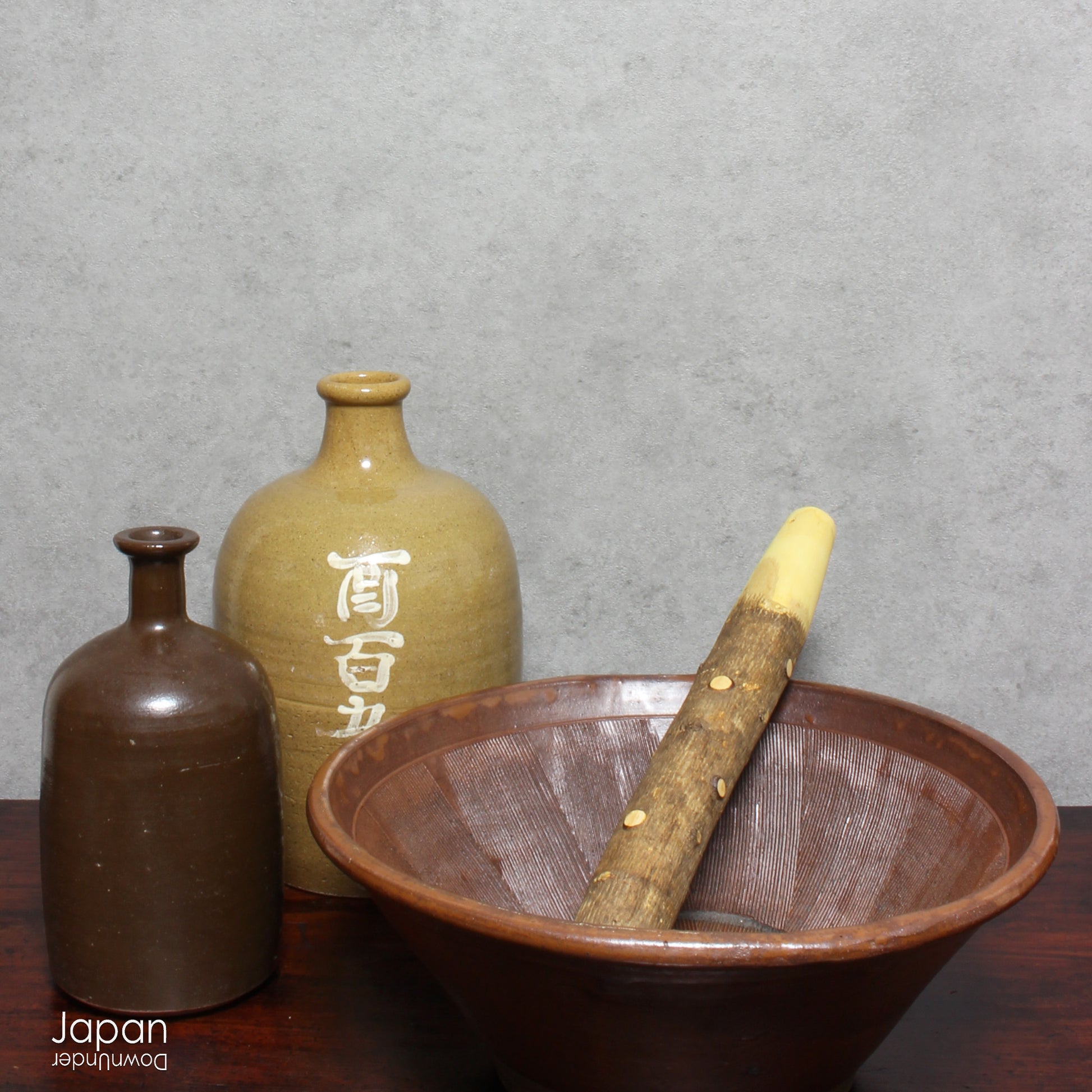 Uncover the charm and eco-conscious history of this 1900s vintage stoneware sake bottle, a one-of-a-kind treasure once used for both the purchase and storage of sake. Perfect for sake enthusiasts, collectors, or anyone looking to add a unique and sustainable piece to their collection, this bottle is a rare find that won’t last long!