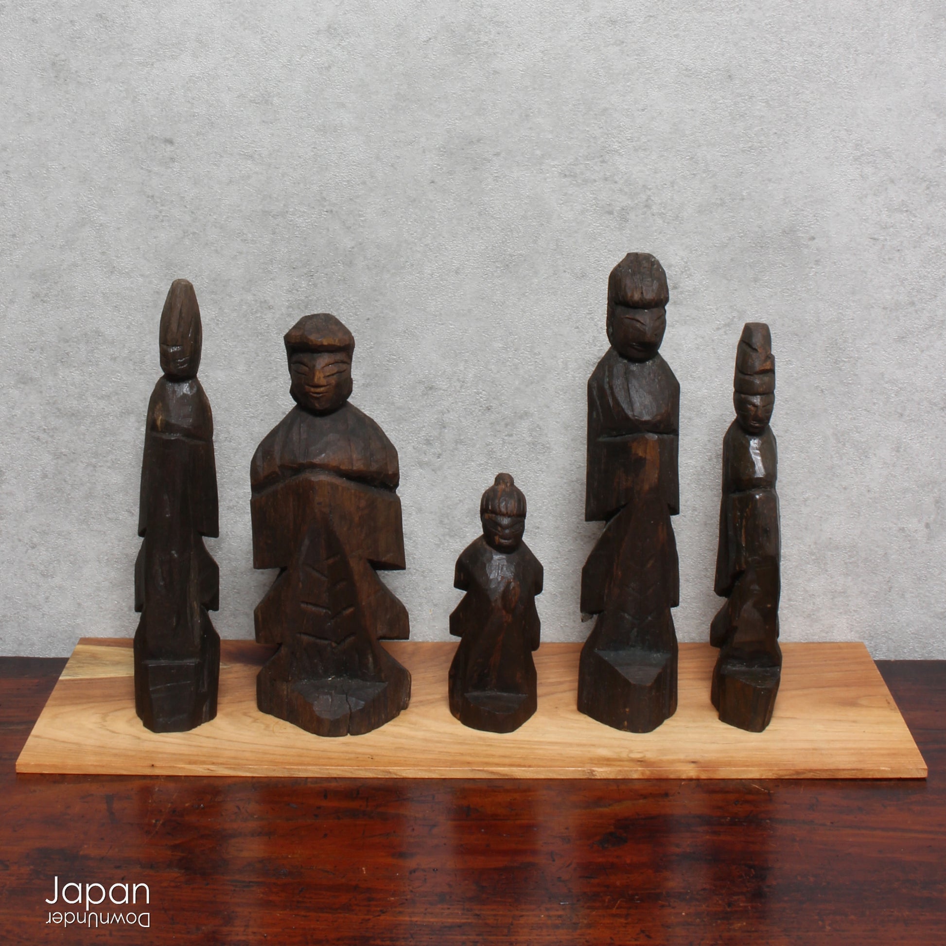 A collection of old hand-carved Enku-style Buddha and Kannon statues.  Enku was a Buddhist monk, much loved for his simple, folk art statues, carved during his many pilgrimages  to the mountains.  These old carvings are made of a light wood.