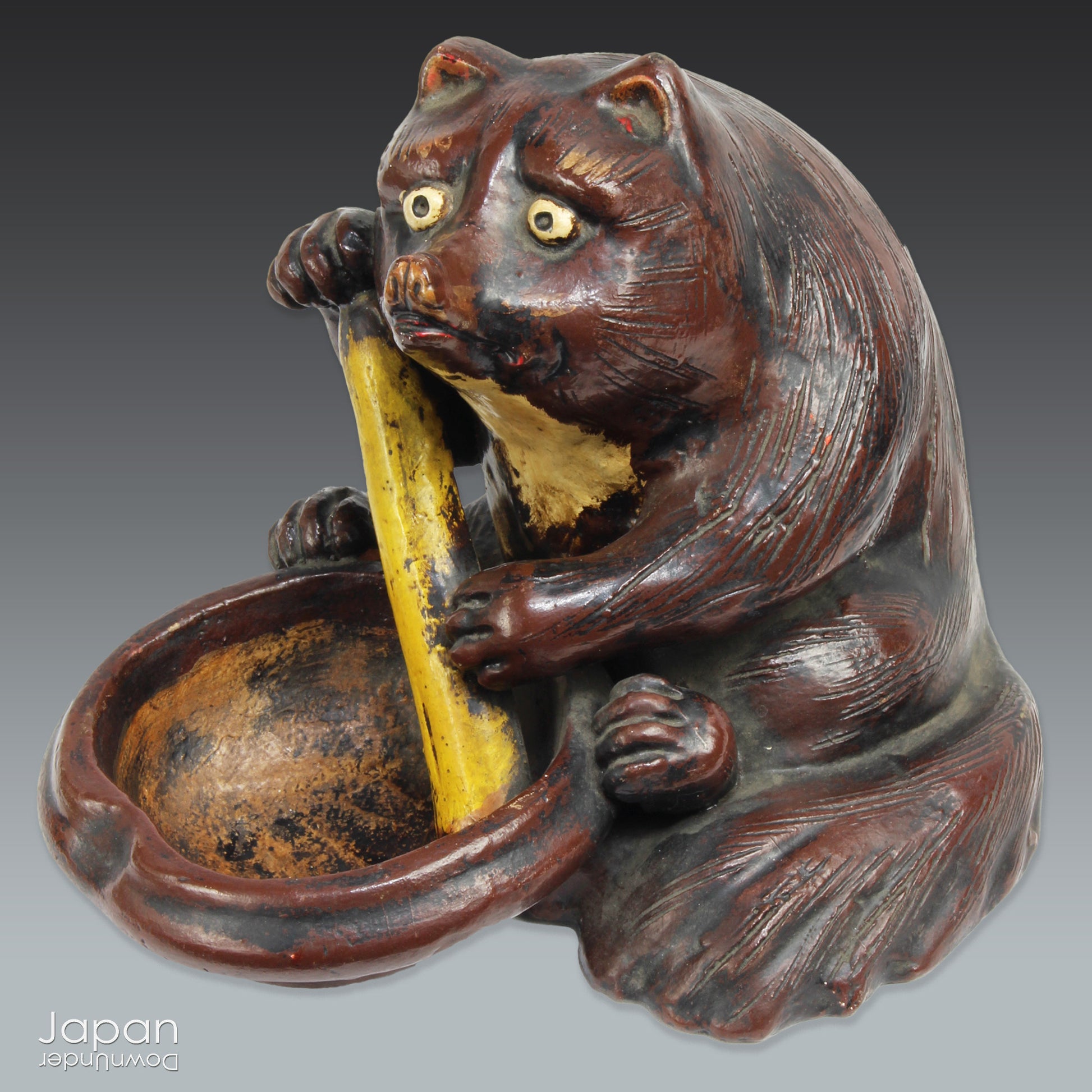 The tanuki has long been cherished in Japanese culture, evolving from a mischievous shapeshifter into a symbol of prosperity, good luck, and jovial mischief. Often associated with wealth and success in business, this playful figure is a familiar sight outside shops and homes - offering not just charm, but blessings too.