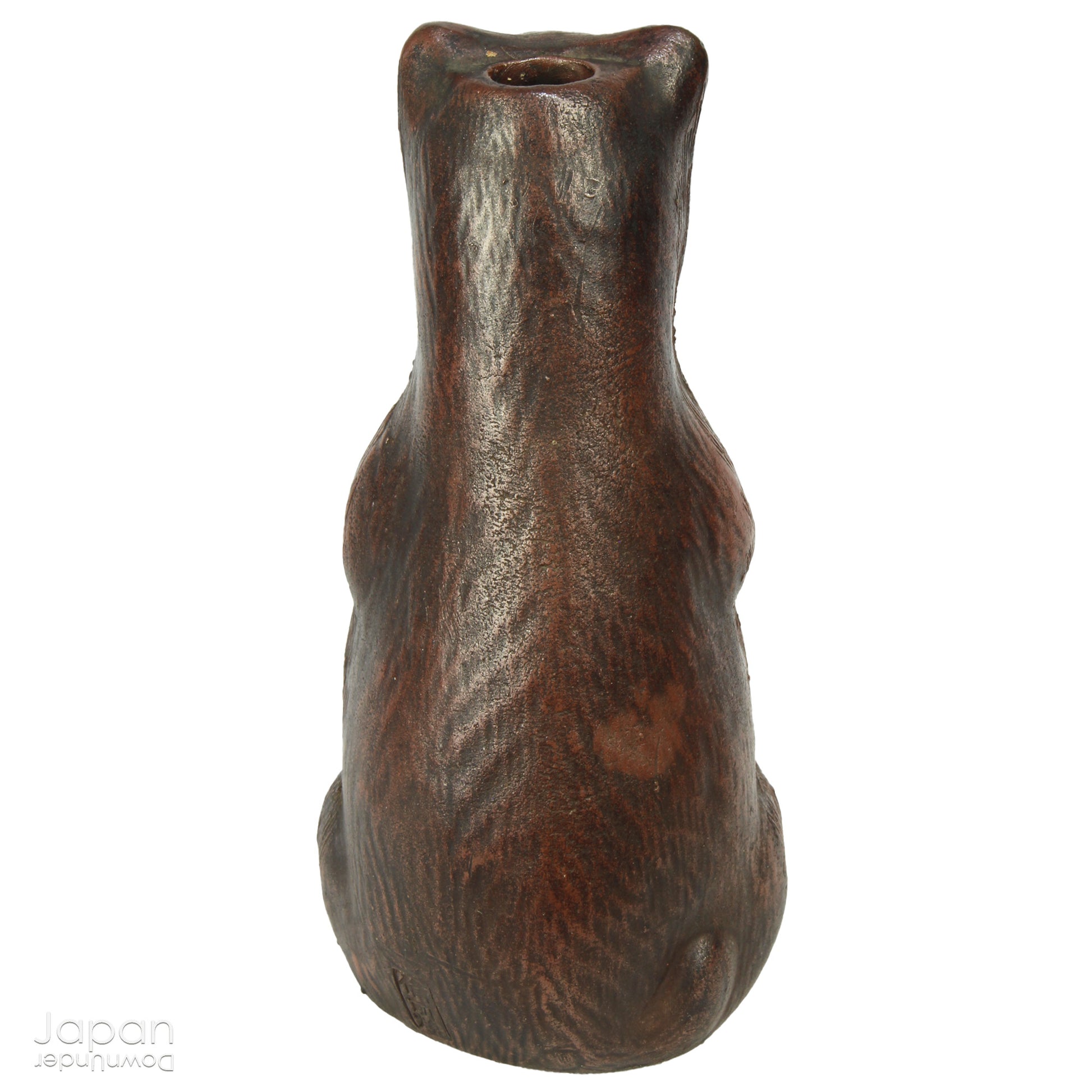 Infuse your space with the timeless elegance of Japanese craftsmanship and folklore through this antique Bizen raccoon dog tokkuri. Not only does it serve its traditional function as a sake pourer, but it also doubles as a captivating piece of art or a charming bud vase, making it a truly versatile addition to your collection.