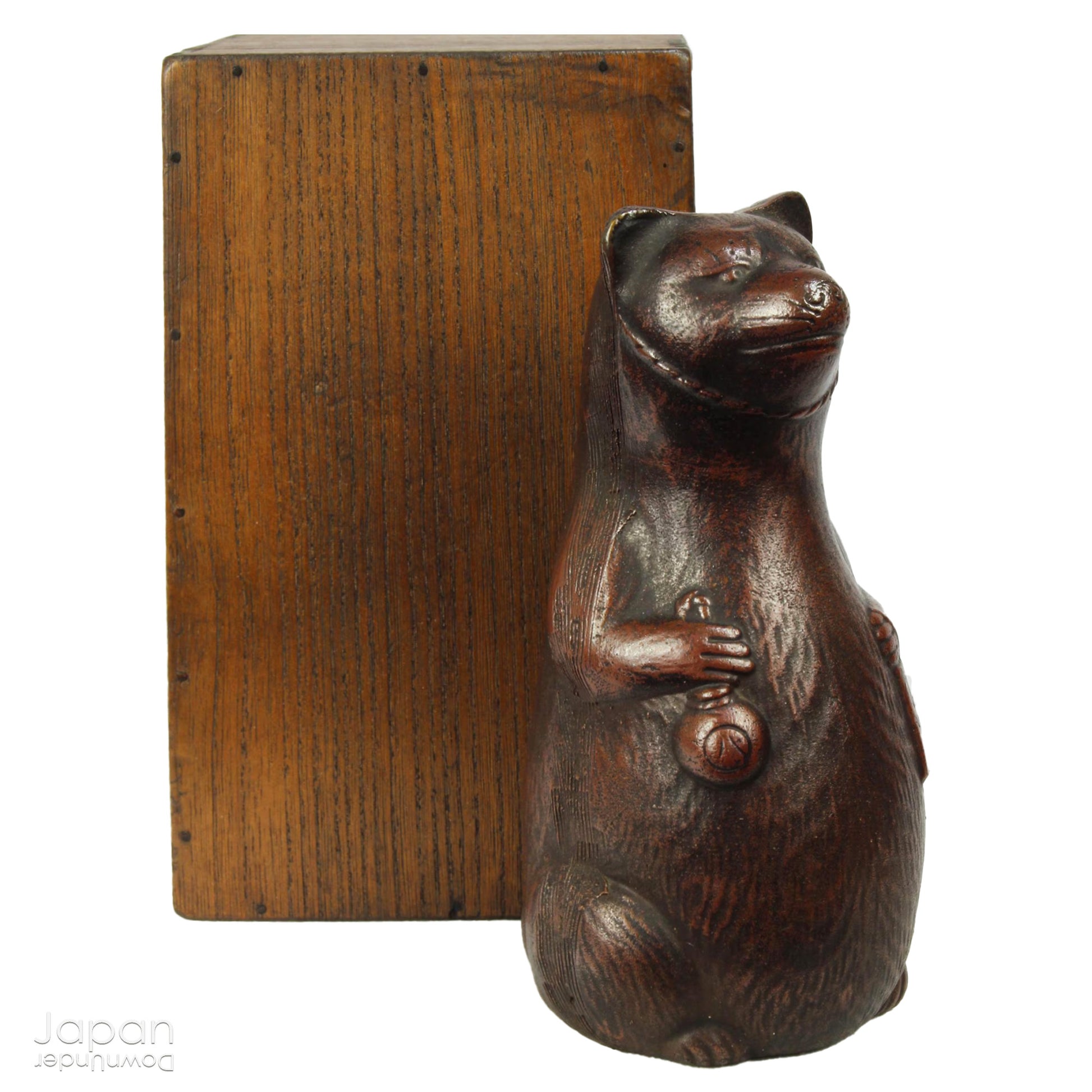 Infuse your space with the timeless elegance of Japanese craftsmanship and folklore through this antique Bizen raccoon dog tokkuri. Not only does it serve its traditional function as a sake pourer, but it also doubles as a captivating piece of art or a charming bud vase, making it a truly versatile addition to your collection.