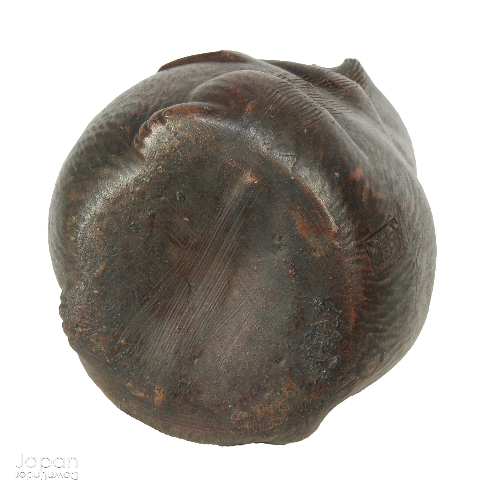 Infuse your space with the timeless elegance of Japanese craftsmanship and folklore through this antique Bizen raccoon dog tokkuri. Not only does it serve its traditional function as a sake pourer, but it also doubles as a captivating piece of art or a charming bud vase, making it a truly versatile addition to your collection.