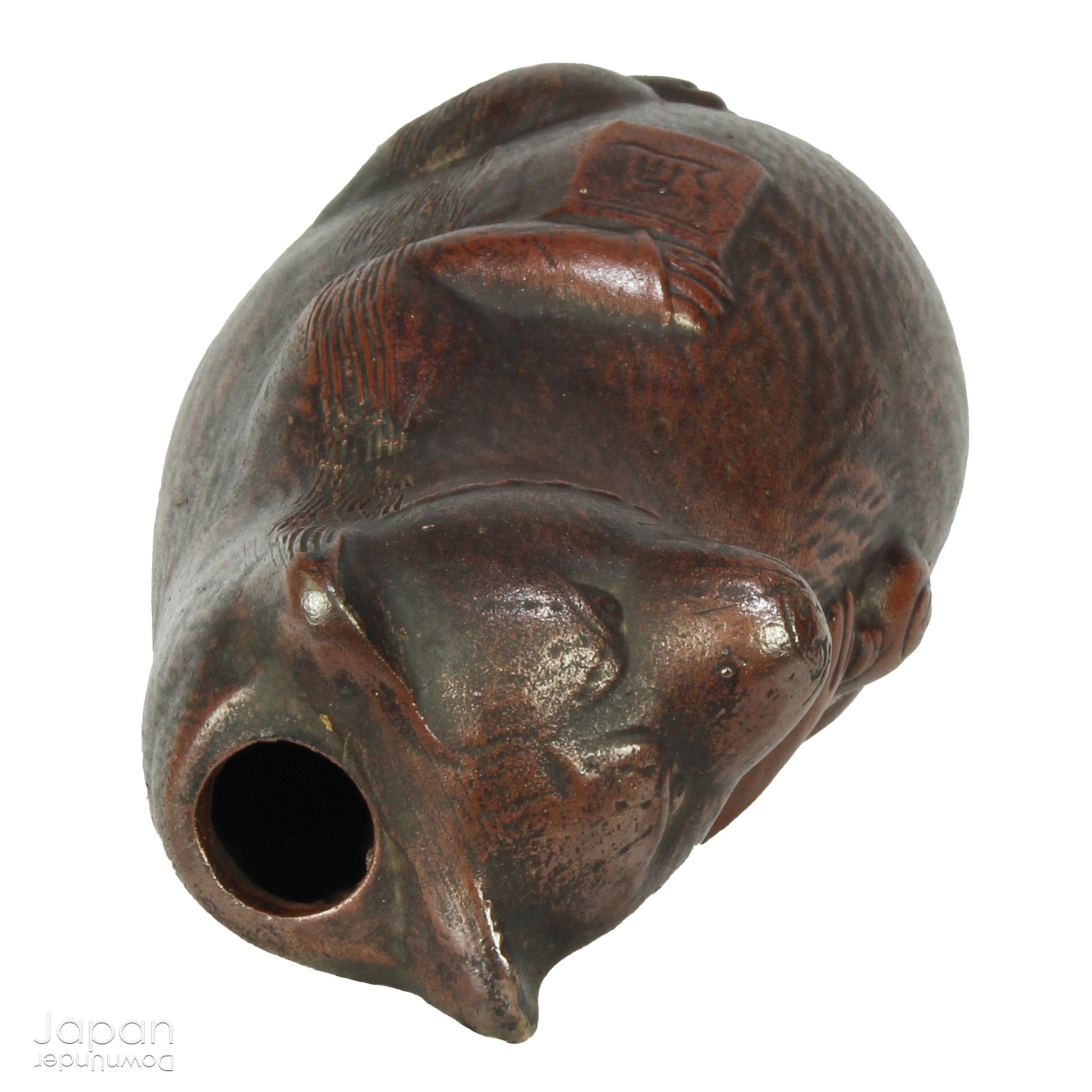 Infuse your space with the timeless elegance of Japanese craftsmanship and folklore through this antique Bizen raccoon dog tokkuri. Not only does it serve its traditional function as a sake pourer, but it also doubles as a captivating piece of art or a charming bud vase, making it a truly versatile addition to your collection.