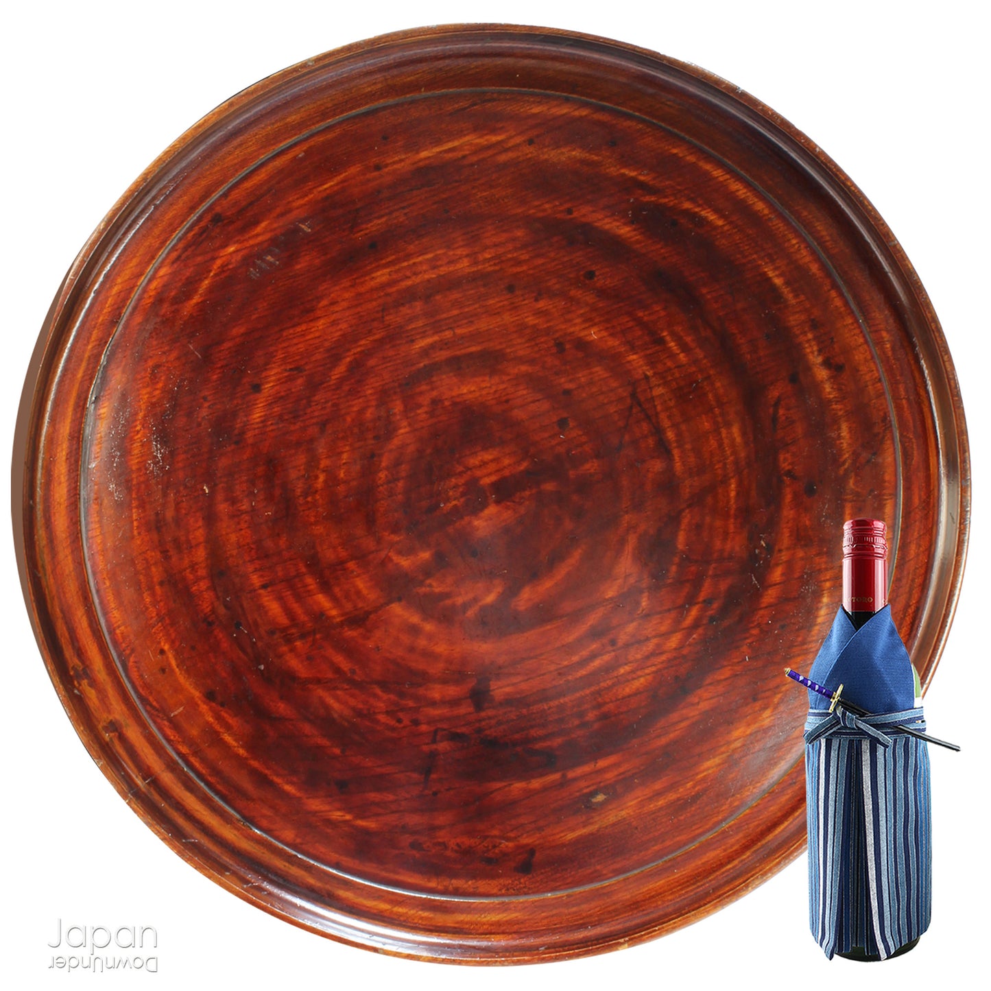 Add timeless charm and rustic elegance to your home with this exceptionally large antique round tea tray, hand-carved from a single cross-section of zelkova (keyaki) wood. A beautiful marriage of form and function, this piece serves equally well as a statement display stand, a unique tabletop, or a traditional tea-serving tray.