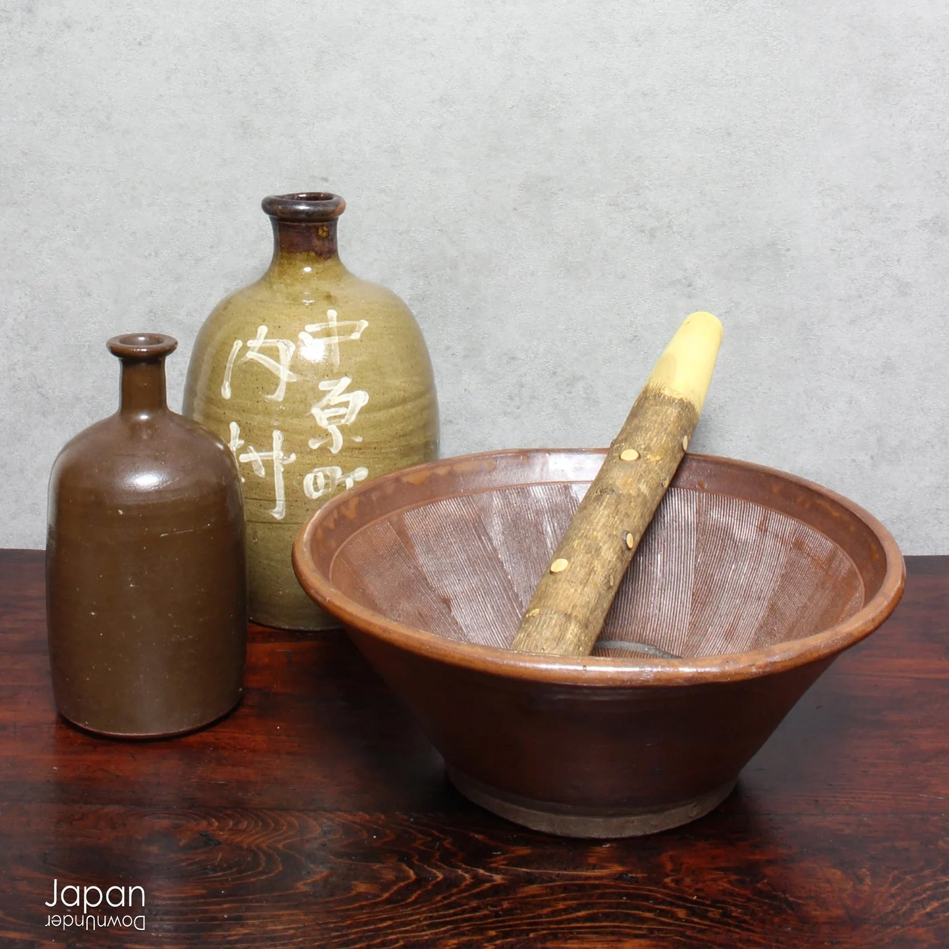 Uncover the charm and eco-conscious history of this 1900s vintage stoneware sake bottle, a one-of-a-kind treasure once used for both the purchase and storage of sake. Perfect for sake enthusiasts, collectors, or anyone looking to add a unique and sustainable piece to their collection, this bottle is a rare find that won’t last long!