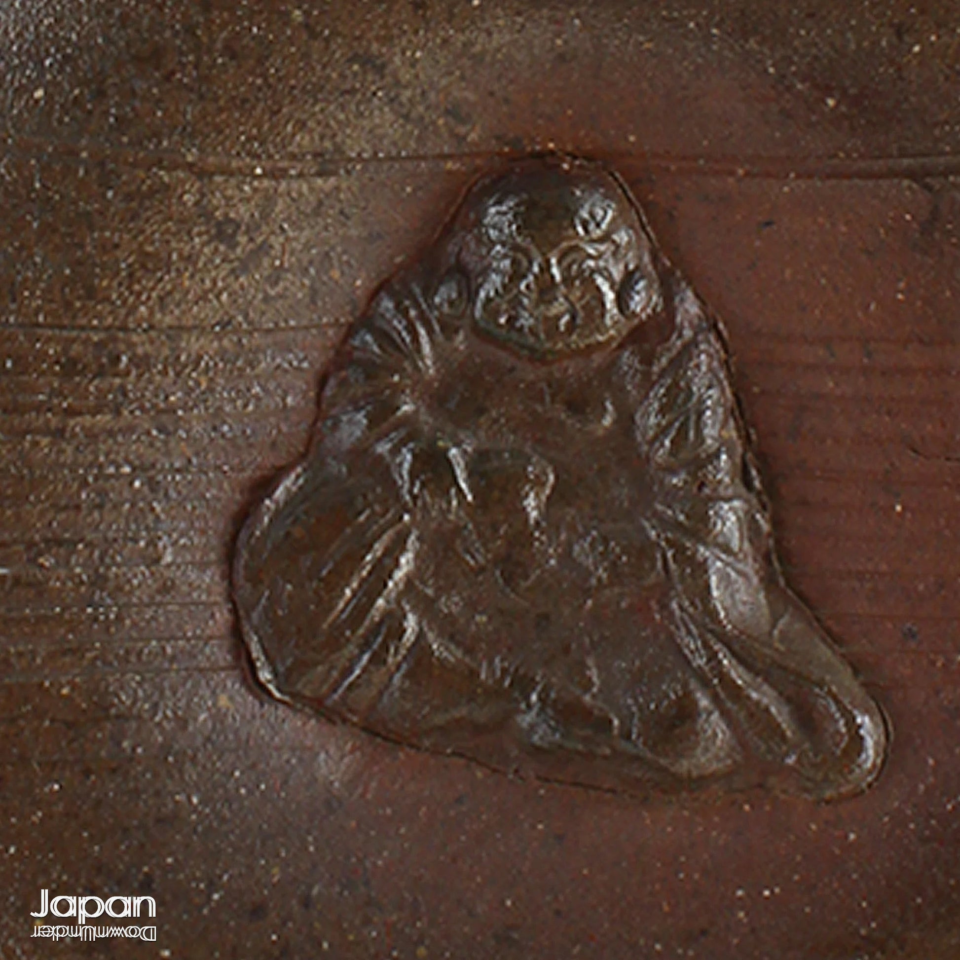 Add depth and story to your interior with this striking Taisho-era Bizen ware sake tokkuri, adorned with Hotei - the cheerful god of happiness, children, and good fortune, and one of Japan’s beloved Seven Lucky Gods. More than just a vessel, this antique bottle is a captivating example of Japanese folk craftsmanship, equally compelling as a sculptural display piece or a uniquely soulful vase.