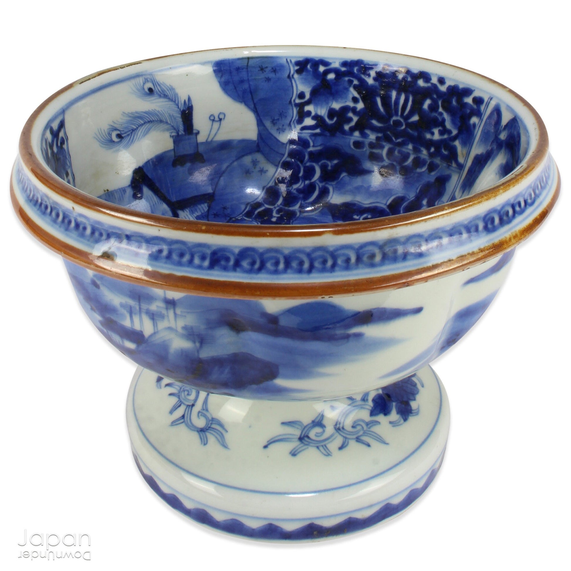 Elevate your home decor with this stunning antique blue and white Imari bowl on a stand. This rare and elegant piece features intricate hand-painted designs, both inside and out, showcasing craftsmanship that will captivate and enchant. Add a touch of sophistication and timeless beauty to any space with this exceptional treasure.