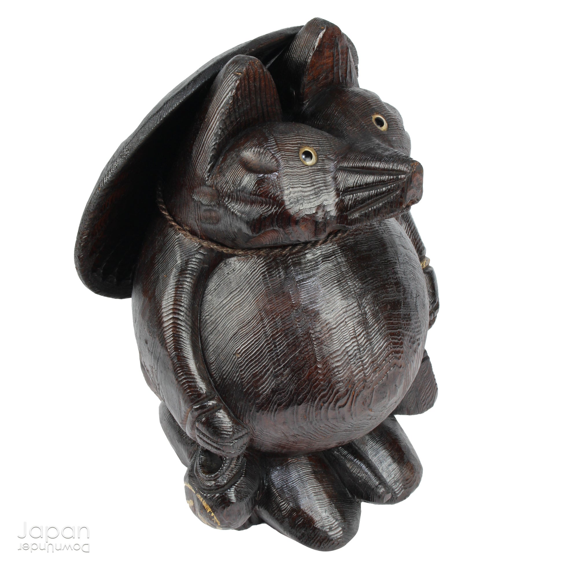 Bring home a delightful piece of traditional Japanese folk art with this exceptionally rare and impressively large antique wooden tanuki -  a beloved symbol of good luck, prosperity, and playful mischief in Japanese culture.