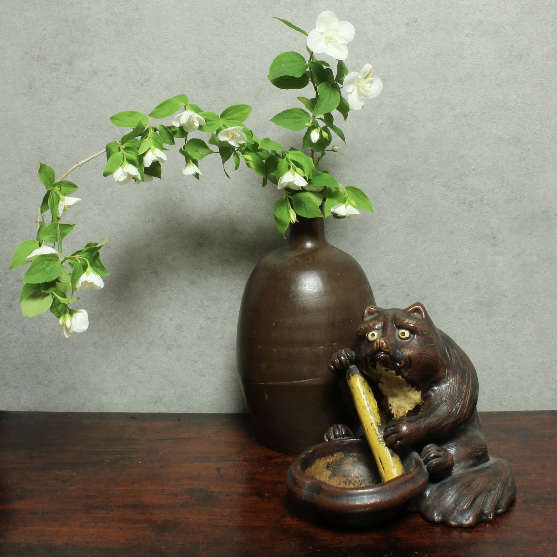 The tanuki has long been cherished in Japanese culture, evolving from a mischievous shapeshifter into a symbol of prosperity, good luck, and jovial mischief. Often associated with wealth and success in business, this playful figure is a familiar sight outside shops and homes - offering not just charm, but blessings too.
