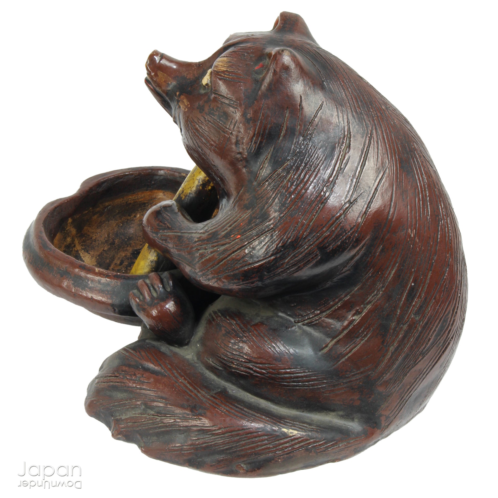 The tanuki has long been cherished in Japanese culture, evolving from a mischievous shapeshifter into a symbol of prosperity, good luck, and jovial mischief. Often associated with wealth and success in business, this playful figure is a familiar sight outside shops and homes - offering not just charm, but blessings too.