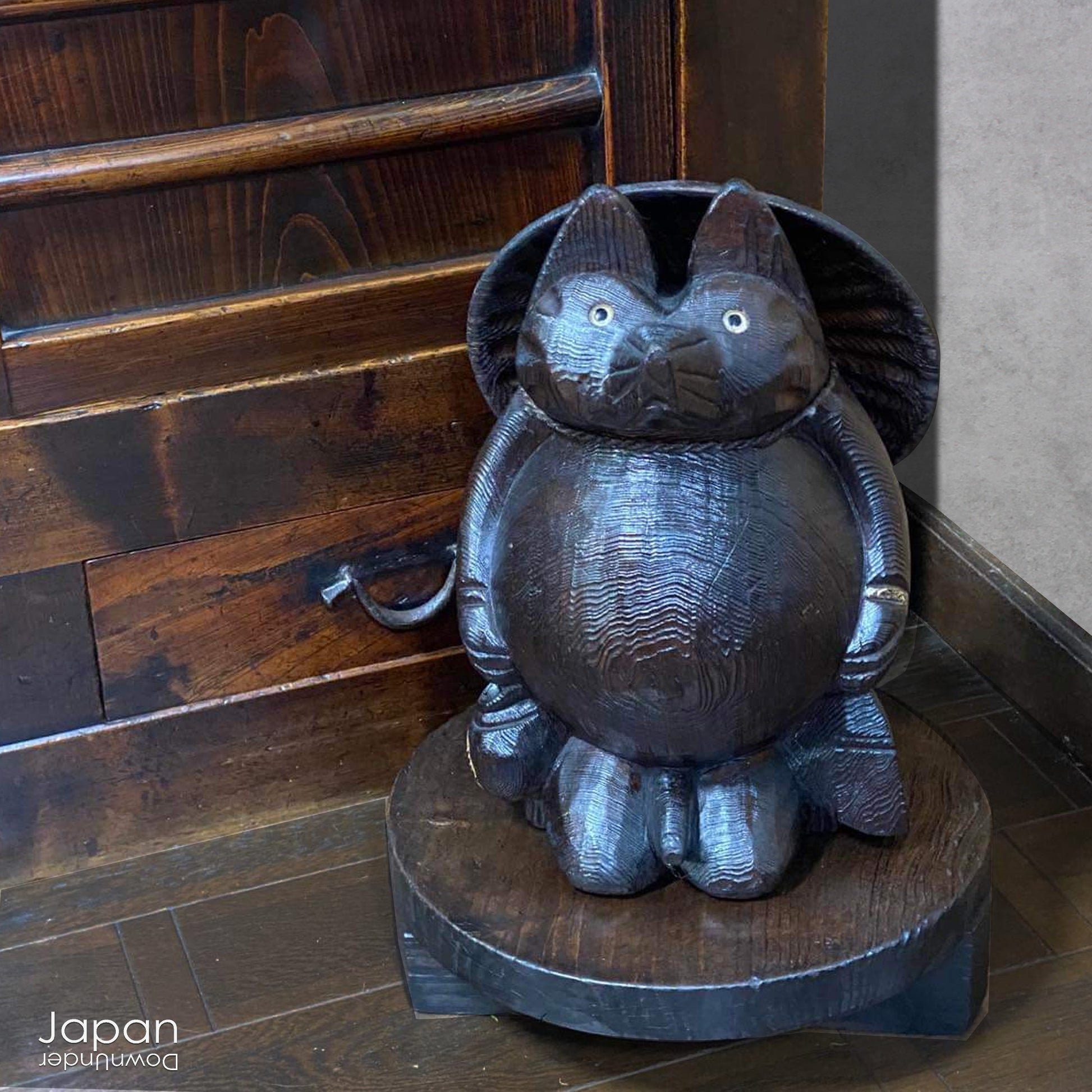 Bring home a delightful piece of traditional Japanese folk art with this exceptionally rare and impressively large antique wooden tanuki -  a beloved symbol of good luck, prosperity, and playful mischief in Japanese culture.