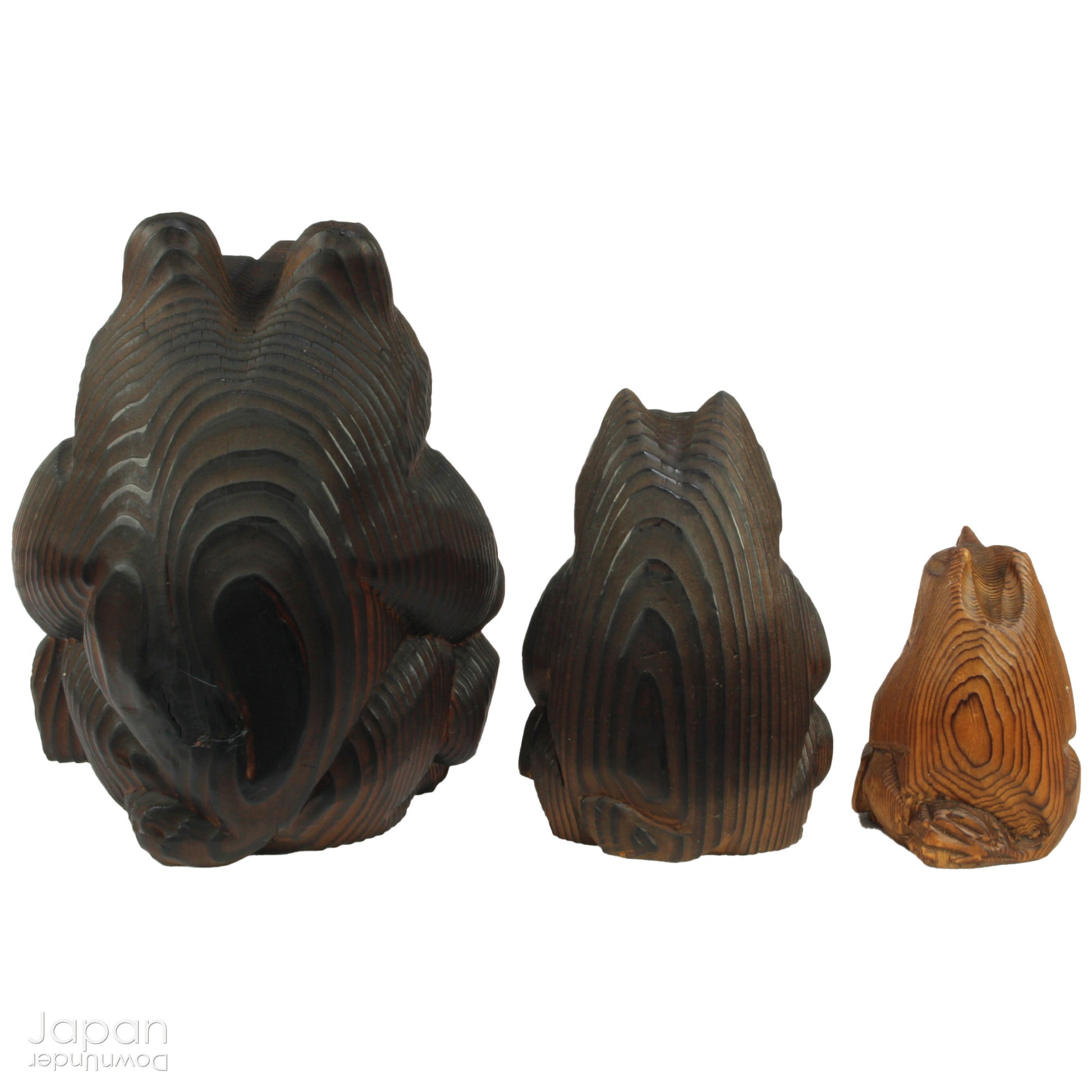 Add a dash of charm and cultural richness to your home with this delightful set of three antique Japanese tanuki wood carvings - authentic examples of traditional Japanese folk art, long believed to be bringers of good luck and prosperity.