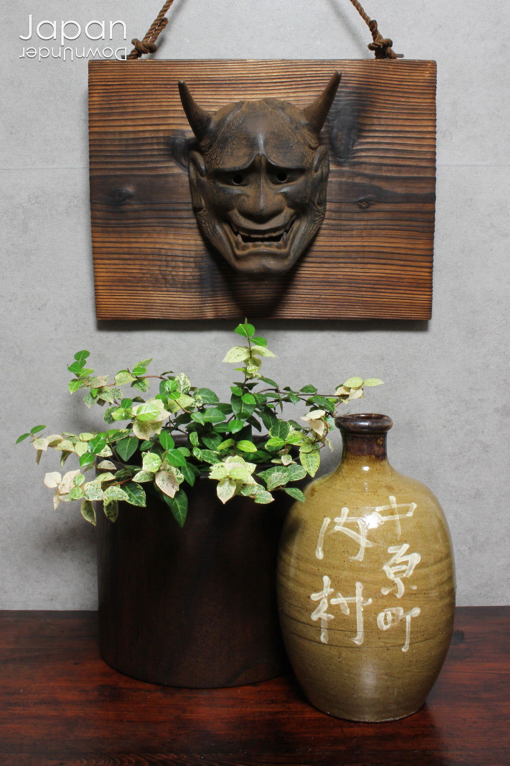 Enhance your space with this unique piece of Japanese folk art! A captivating old rusted bronze Hannya mask mounted on a charming rustic wood plaque - a truly wonderful addition to your wall decor. Infuse your home with the character and culture of this stunning find!