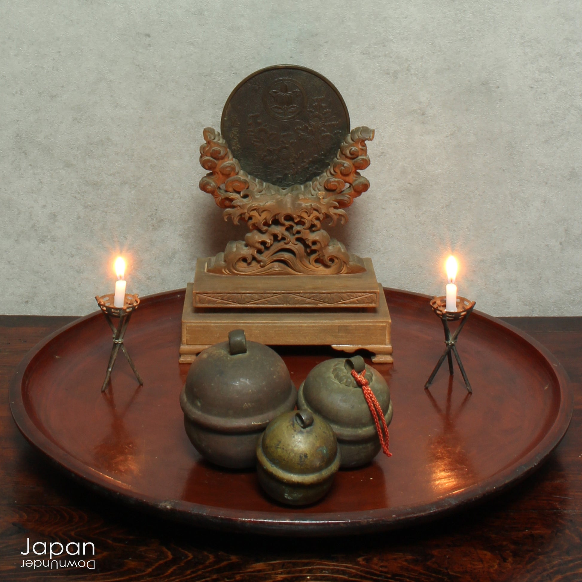 A stunning 1800’s Japanese folk art round serving tray. This versatile piece doubles as a unique display stand adding a touch of rustic charm to any decor. The beautiful dark wine red and black color palette showcases the wonderful patina of use, making it a truly one-of-a-kind art object.