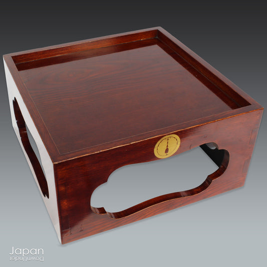 Add a touch of timeless charm to your space with this vintage lacquered wood tray, complete with elegant legs for a stylish and functional design. Its rich, warm brown tones beautifully complement the gold "mon" accent, offering a sophisticated blend of tradition and modern appeal. Whether you use it as a tray or a display stand, this versatile piece is perfect for both tabletop and floor use, making it a stunning addition to any room.