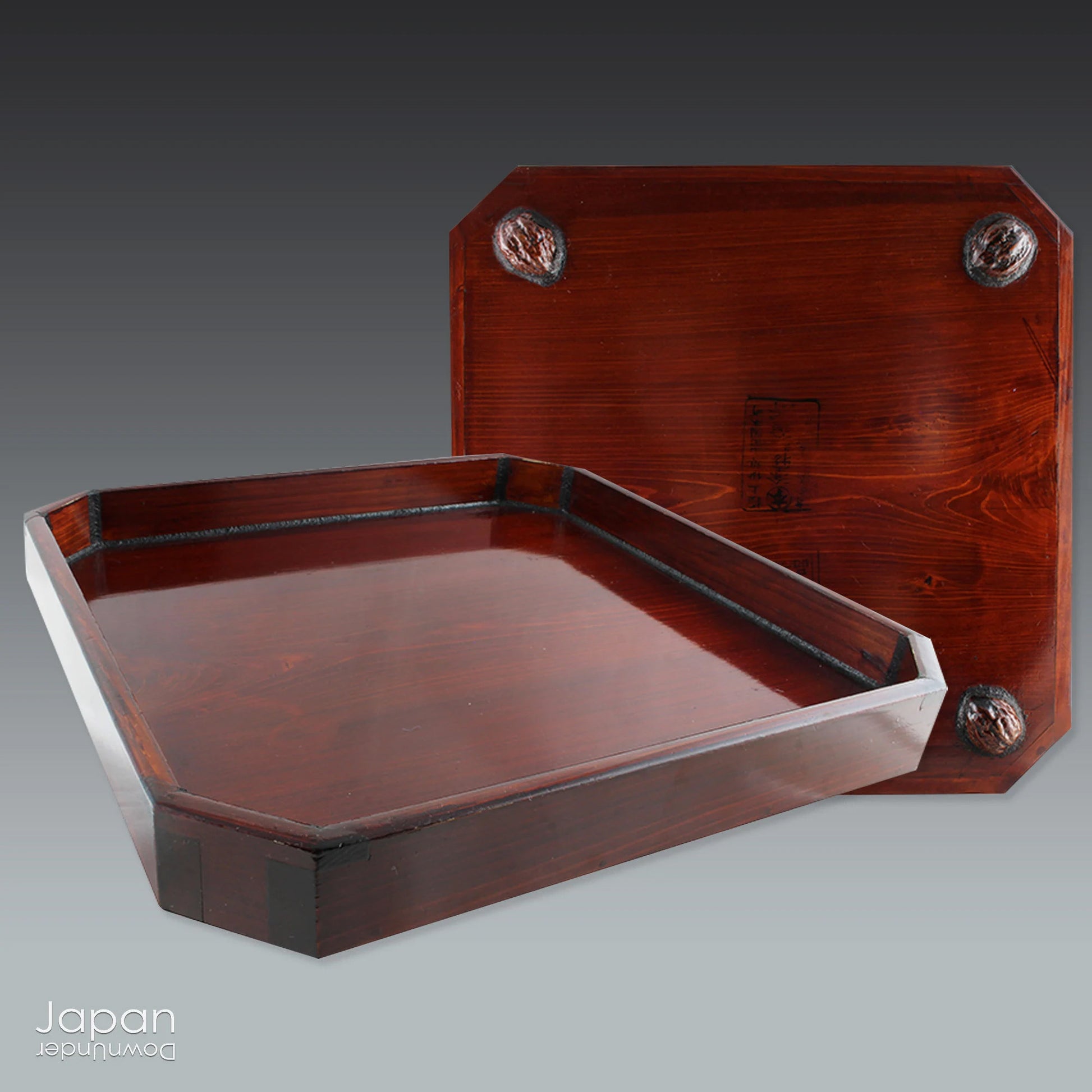 Infuse your space with refined charm through this glossy vintage Japanese lacquer tray - an exquisite fusion of traditional artistry and modern design. Poised gracefully on sculptural walnut shell legs, this distinctive piece is both functional and decorative, perfect for serving or showcasing your cherished treasures.