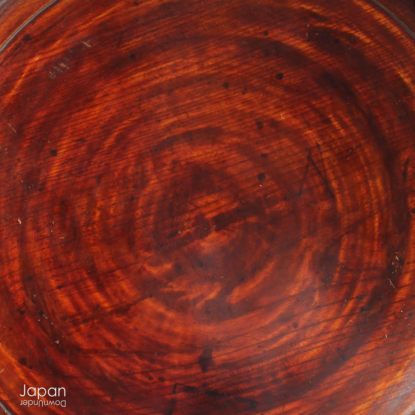 Add timeless charm and rustic elegance to your home with this exceptionally large antique round tea tray, hand-carved from a single cross-section of zelkova (keyaki) wood. A beautiful marriage of form and function, this piece serves equally well as a statement display stand, a unique tabletop, or a traditional tea-serving tray.