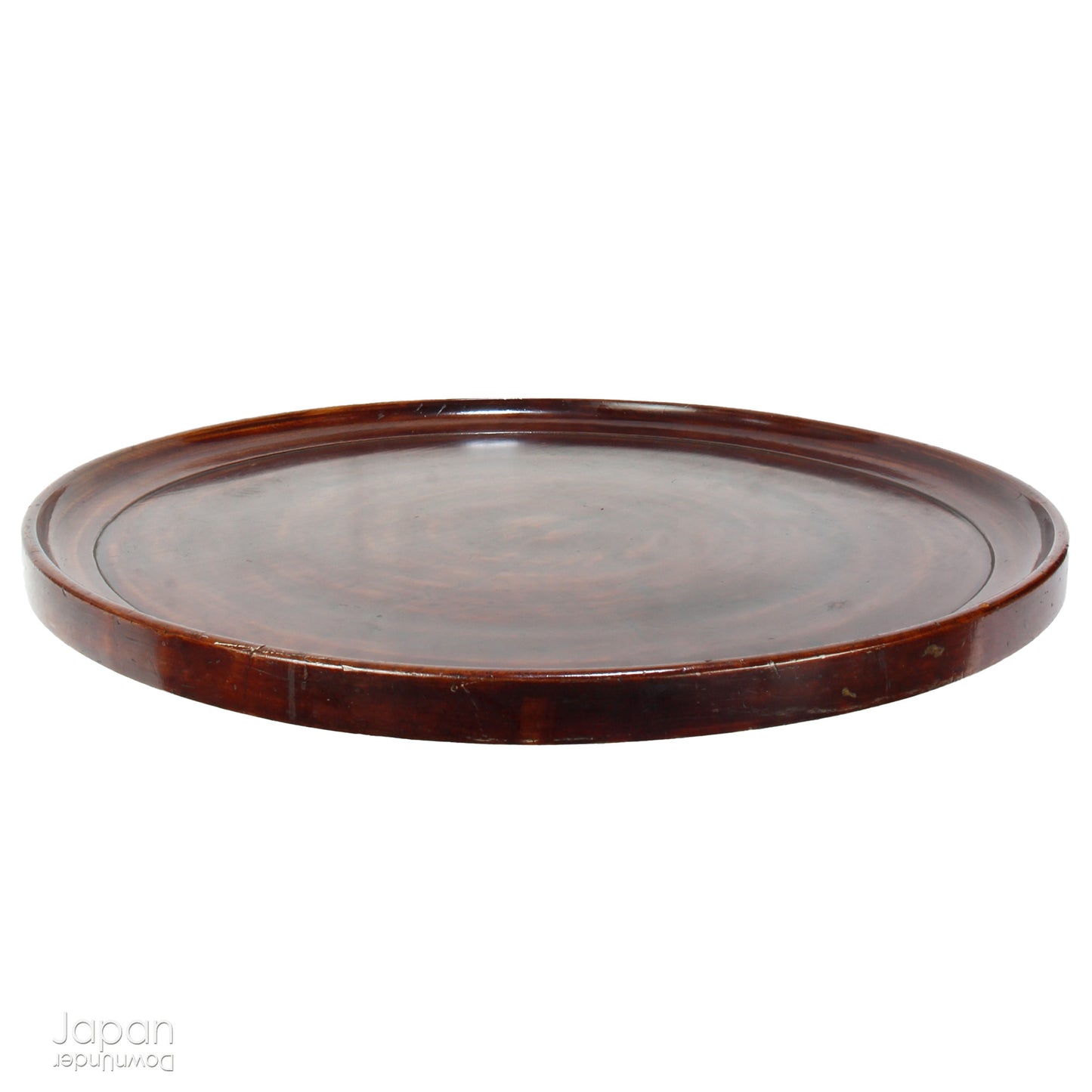 Add timeless charm and rustic elegance to your home with this exceptionally large antique round tea tray, hand-carved from a single cross-section of zelkova (keyaki) wood. A beautiful marriage of form and function, this piece serves equally well as a statement display stand, a unique tabletop, or a traditional tea-serving tray.