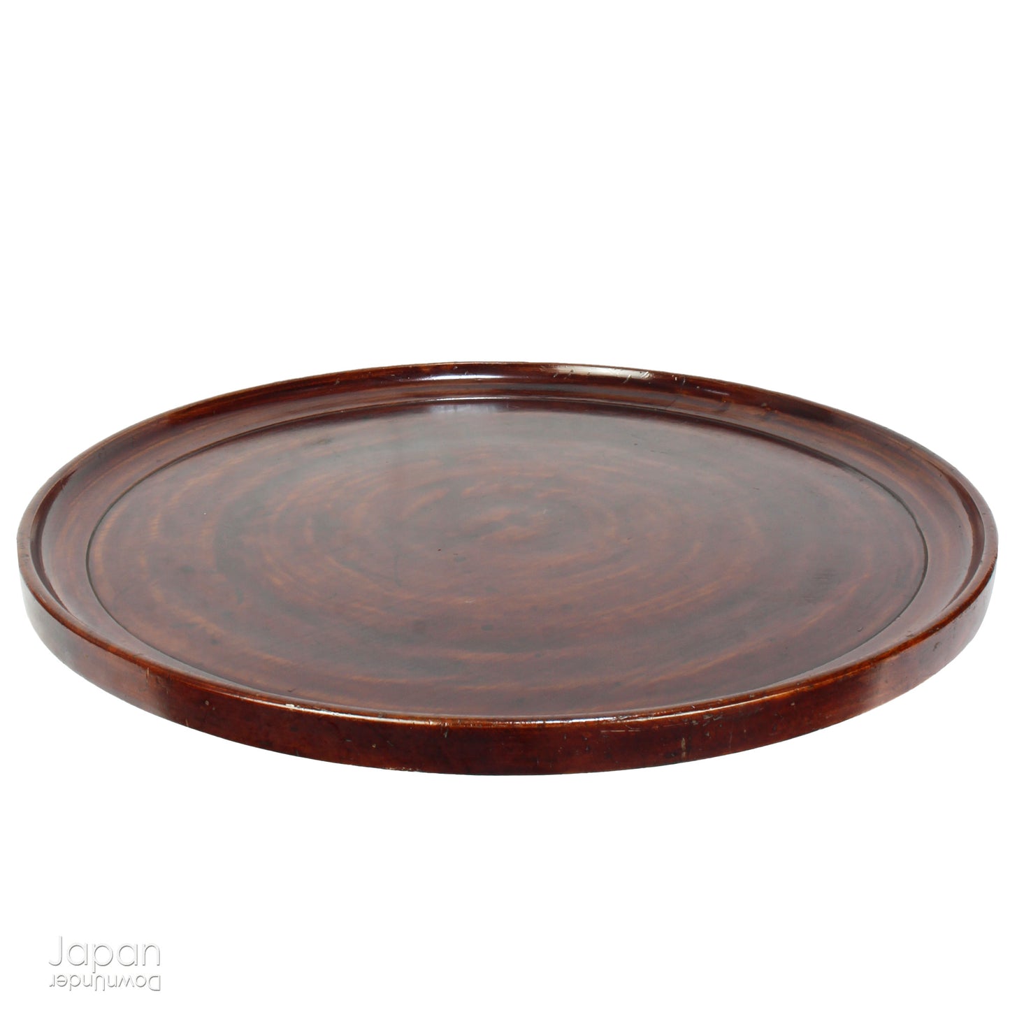 Add timeless charm and rustic elegance to your home with this exceptionally large antique round tea tray, hand-carved from a single cross-section of zelkova (keyaki) wood. A beautiful marriage of form and function, this piece serves equally well as a statement display stand, a unique tabletop, or a traditional tea-serving tray.
