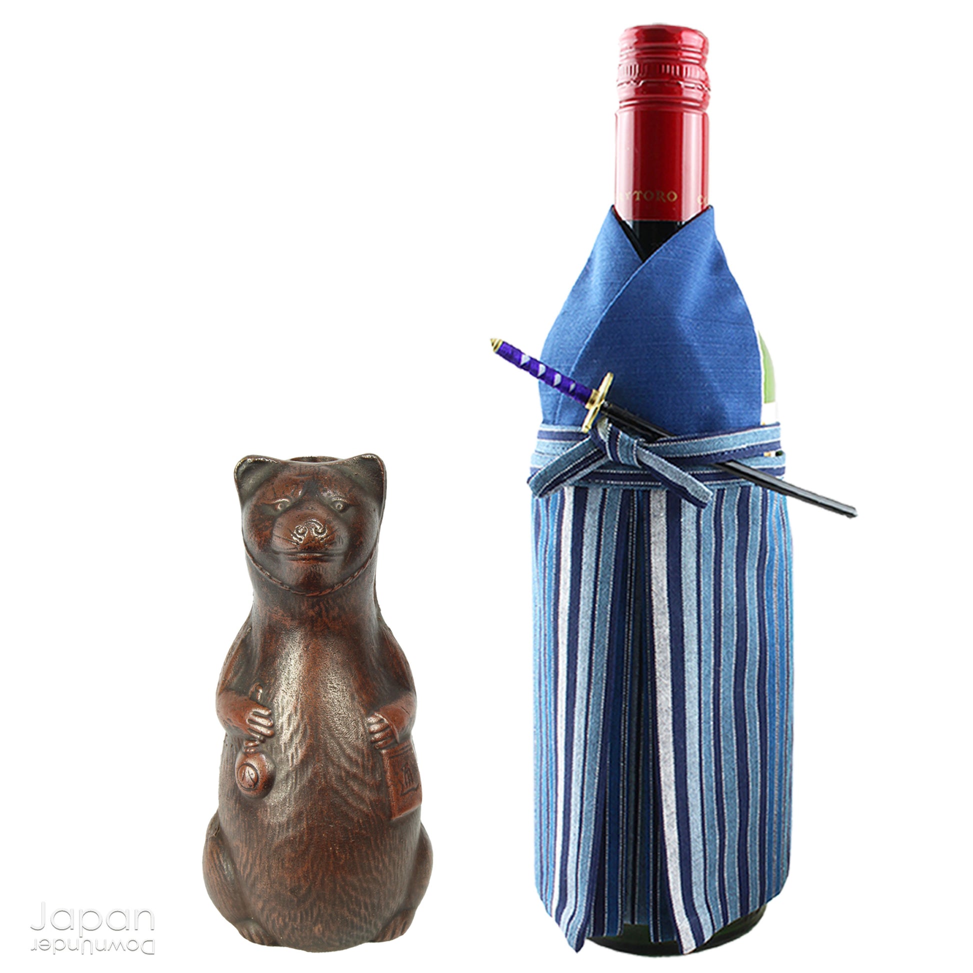 Infuse your space with the timeless elegance of Japanese craftsmanship and folklore through this antique Bizen raccoon dog tokkuri. Not only does it serve its traditional function as a sake pourer, but it also doubles as a captivating piece of art or a charming bud vase, making it a truly versatile addition to your collection.