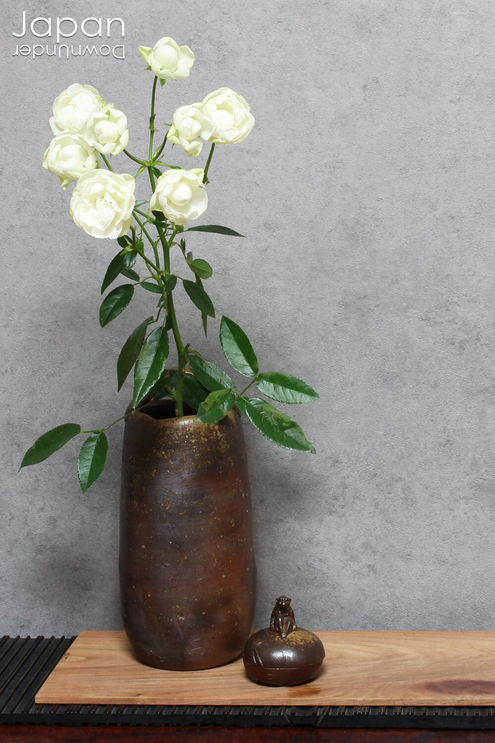 This hanaire - a flower vase used in the Japanese tea ceremony - is crafted in classic Bizen style, known for its unglazed, natural beauty. Bizen ware hails from one of Japan’s six ancient kilns and has been prized for its organic aesthetic and enduring strength since the medieval era.