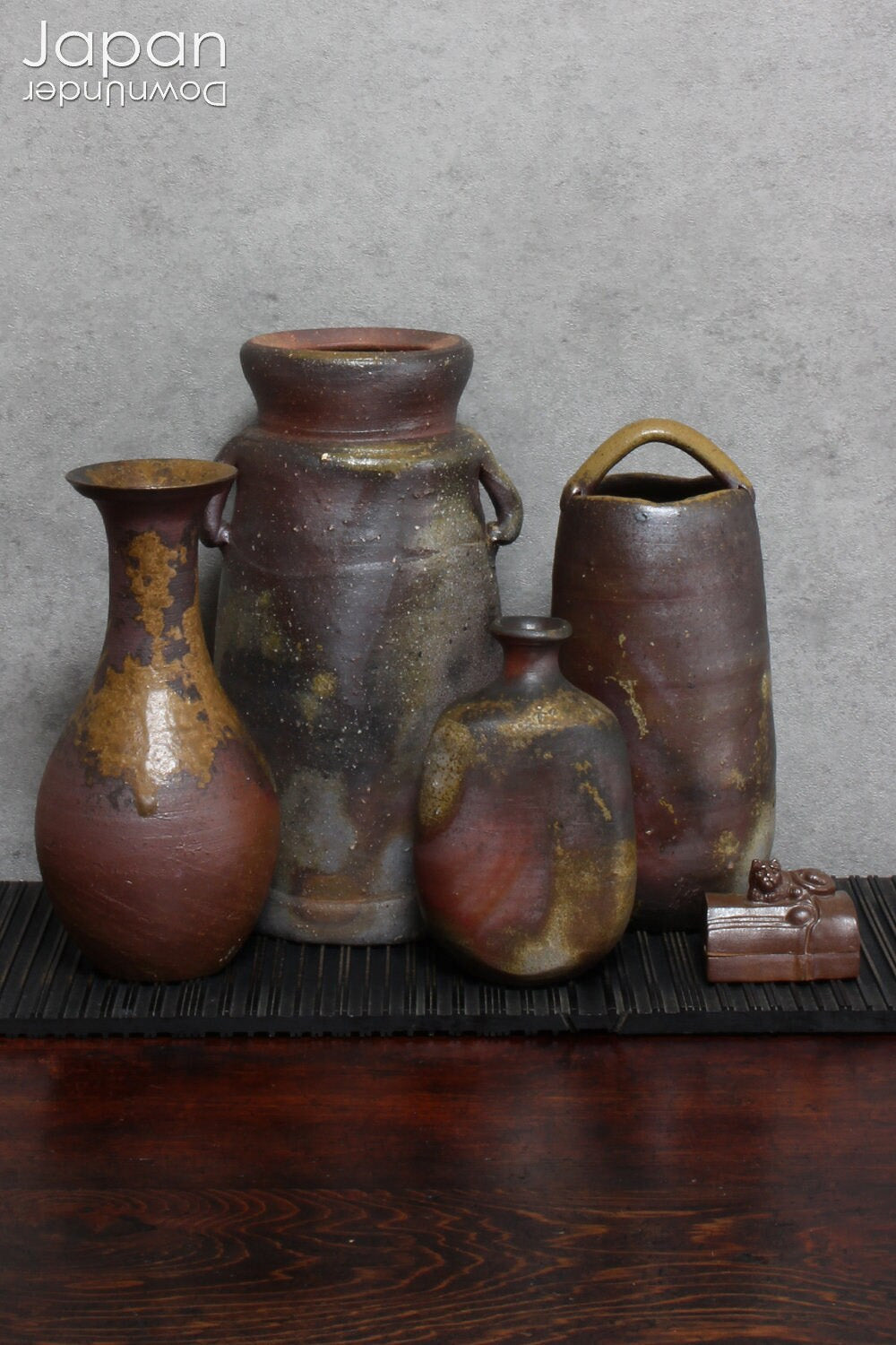 This hanaire - a flower vase used in the Japanese tea ceremony - is crafted in classic Bizen style, known for its unglazed, natural beauty. Bizen ware hails from one of Japan’s six ancient kilns and has been prized for its organic aesthetic and enduring strength since the medieval era.