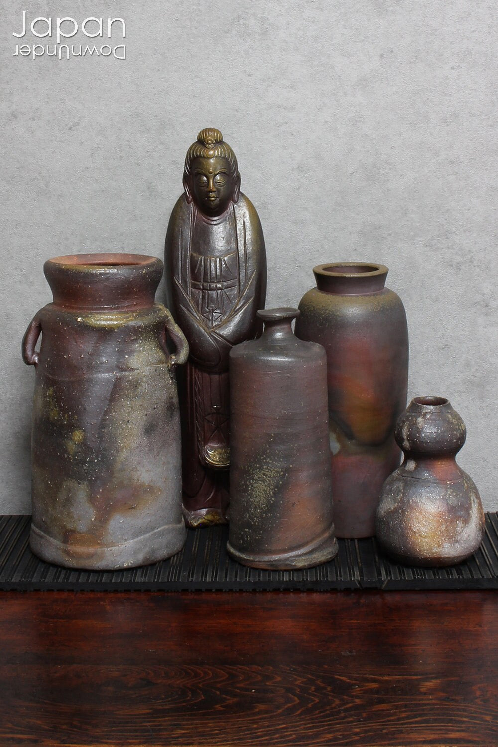 Handcrafted in classic Bizen style, this vase showcases the raw, unglazed clay and natural firing marks that make Bizen pottery so revered. Originating from one of Japan’s Six Ancient Kilns, Bizen ware has been treasured for its earthy textures, rich patina, and exceptional durability since the 12th century.