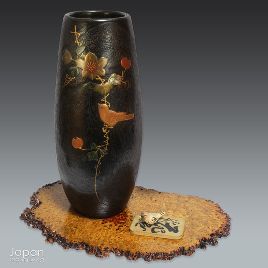 Infuse your space with natural beauty and artisanal charm with this vintage wood vase, adorned with delicate bird and flower motifs in traditional Japanese lacquer. A true celebration of craftsmanship, this handcrafted piece is perfect for displaying fresh seasonal blooms or standing gracefully on its own as a decorative accent.