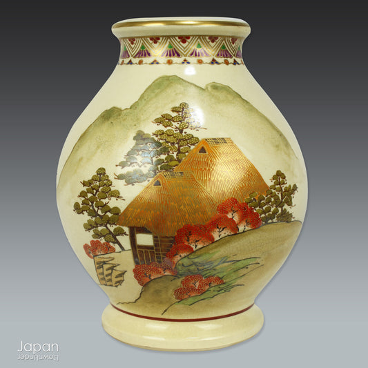 A beautiful example of traditional Japanese artistry, this vintage Satsuma porcelain vase is adorned with a serene hand-painted scene of a rustic mountain hut set amidst a tranquil autumn landscape. Rich in detail and warmth, it captures the essence of seasonal beauty with refined craftsmanship.