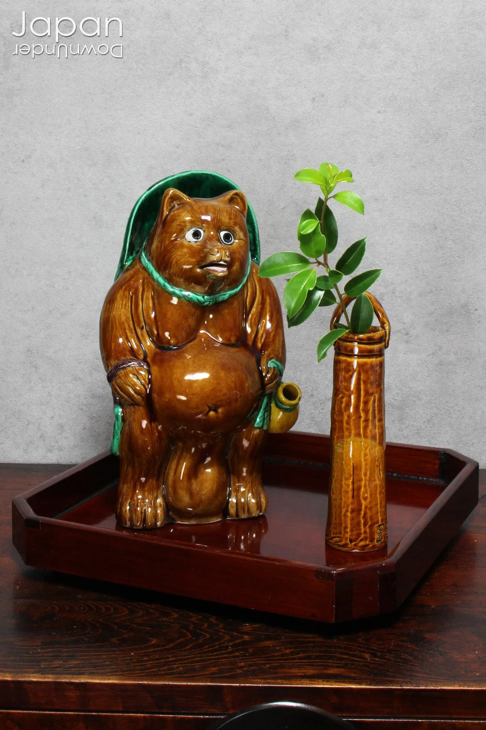 Infuse your space with refined charm through this glossy vintage Japanese lacquer tray - an exquisite fusion of traditional artistry and modern design. Poised gracefully on sculptural walnut shell legs, this distinctive piece is both functional and decorative, perfect for serving or showcasing your cherished treasures.